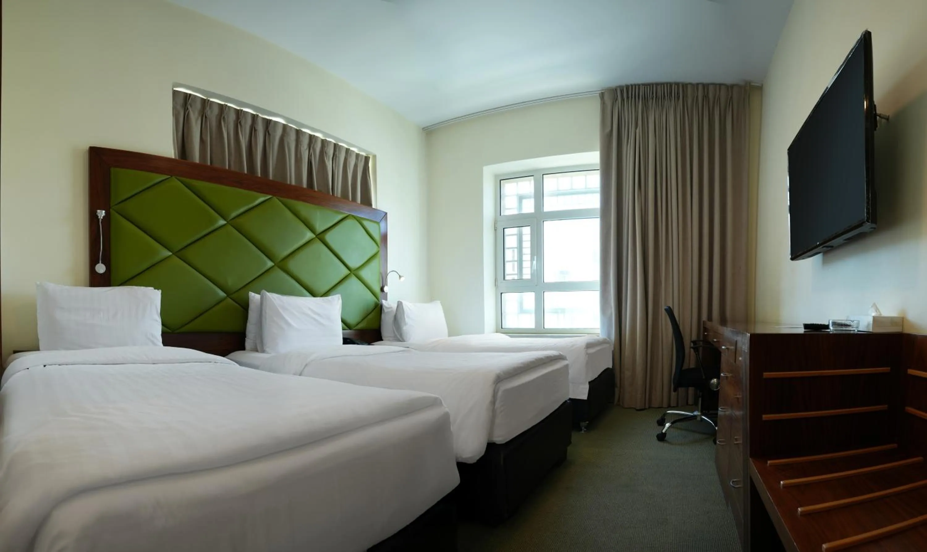 Bed in Holyland Hotel Amman