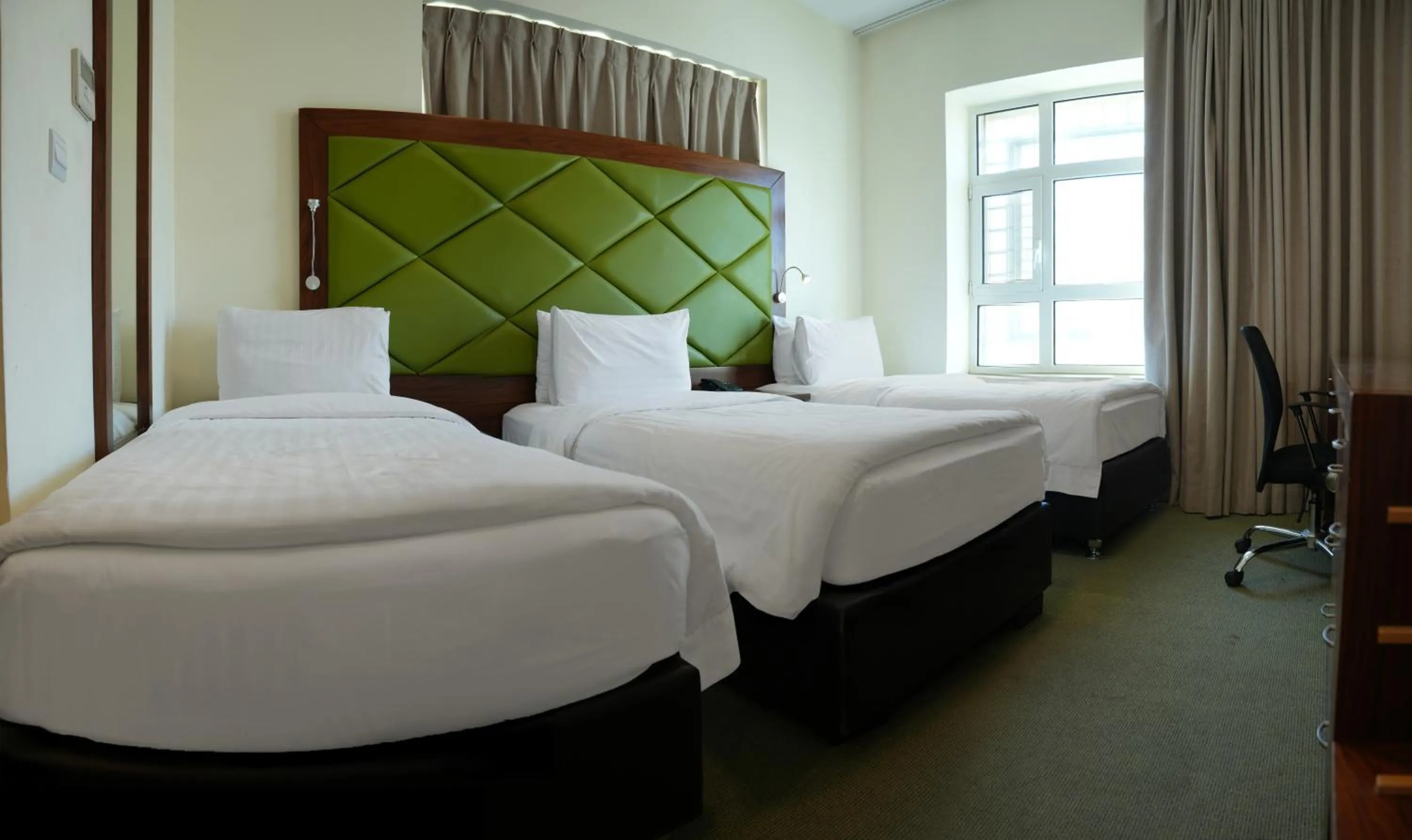 Bed in Holyland Hotel Amman