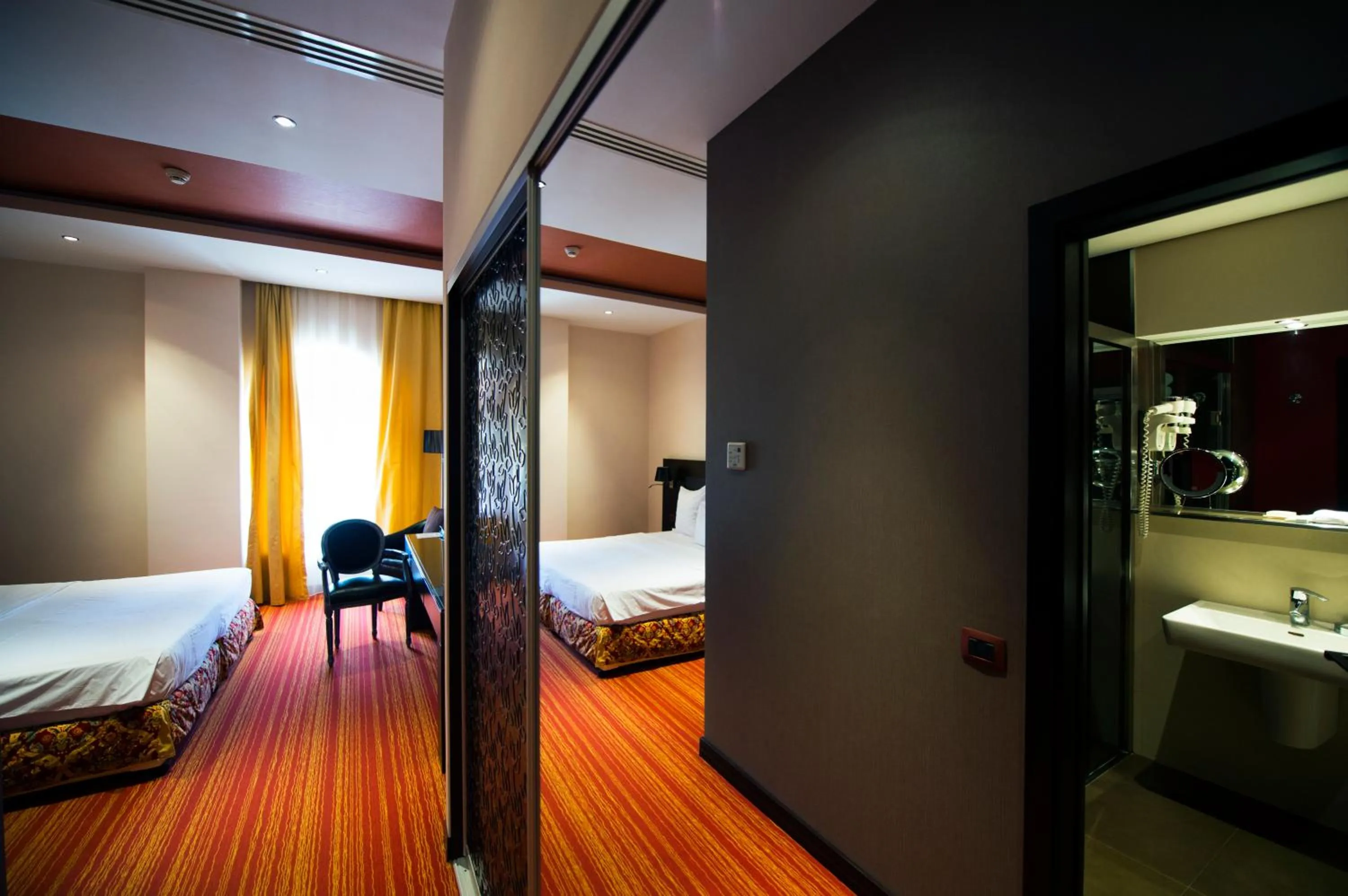 Seating area, Bed in Nane Hotel