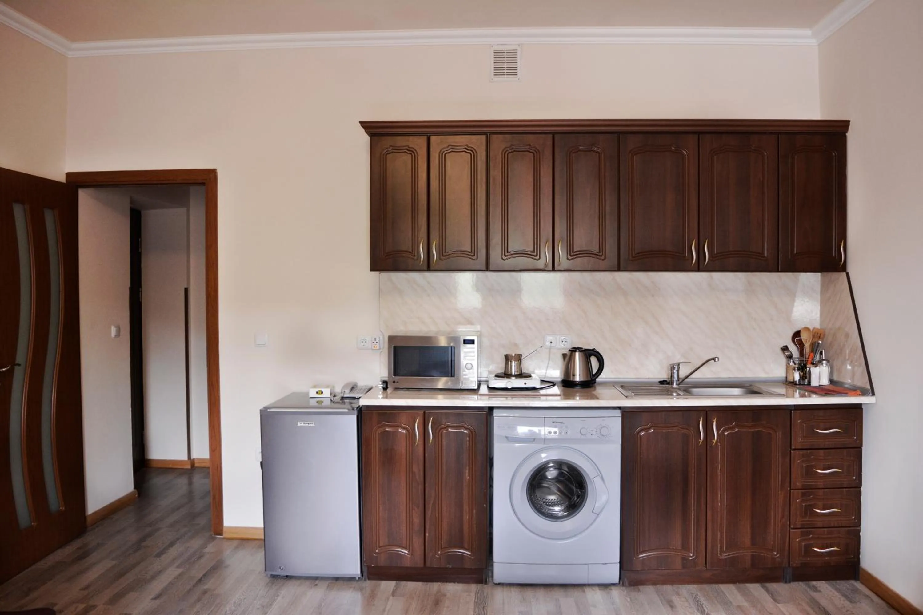 Kitchen or kitchenette in Family Hotel