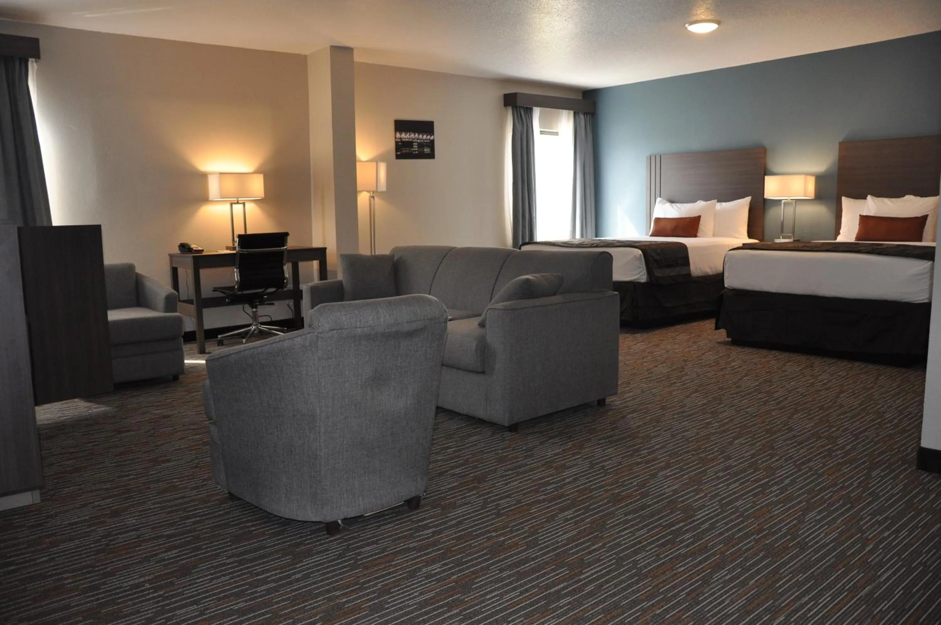 Seating area, Bed in Nobile Hotel Parkway at Celebration Orlando Very Close to Disney Theme Parks