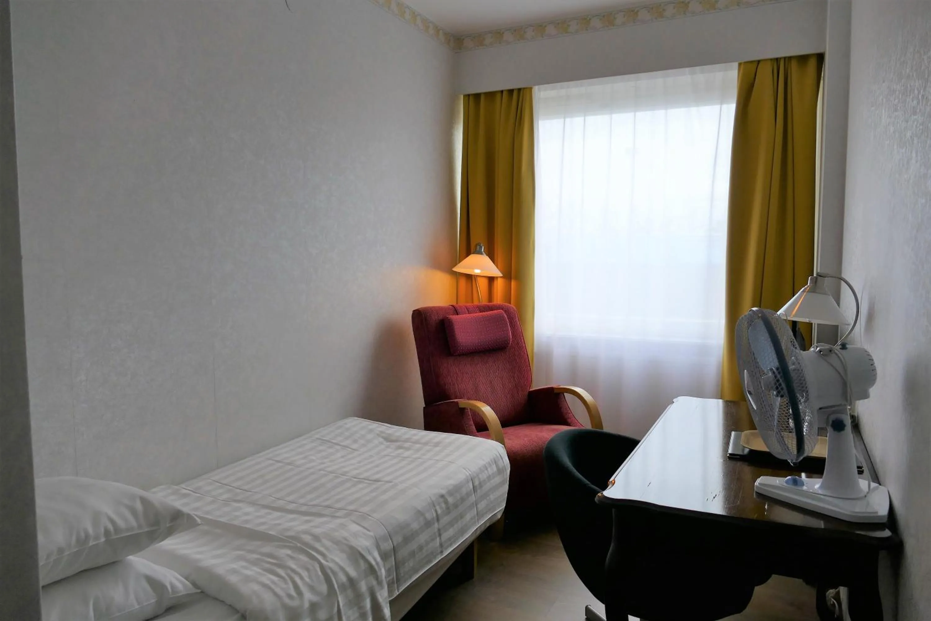 Bed in Linnanpiha Bed & Breakfast