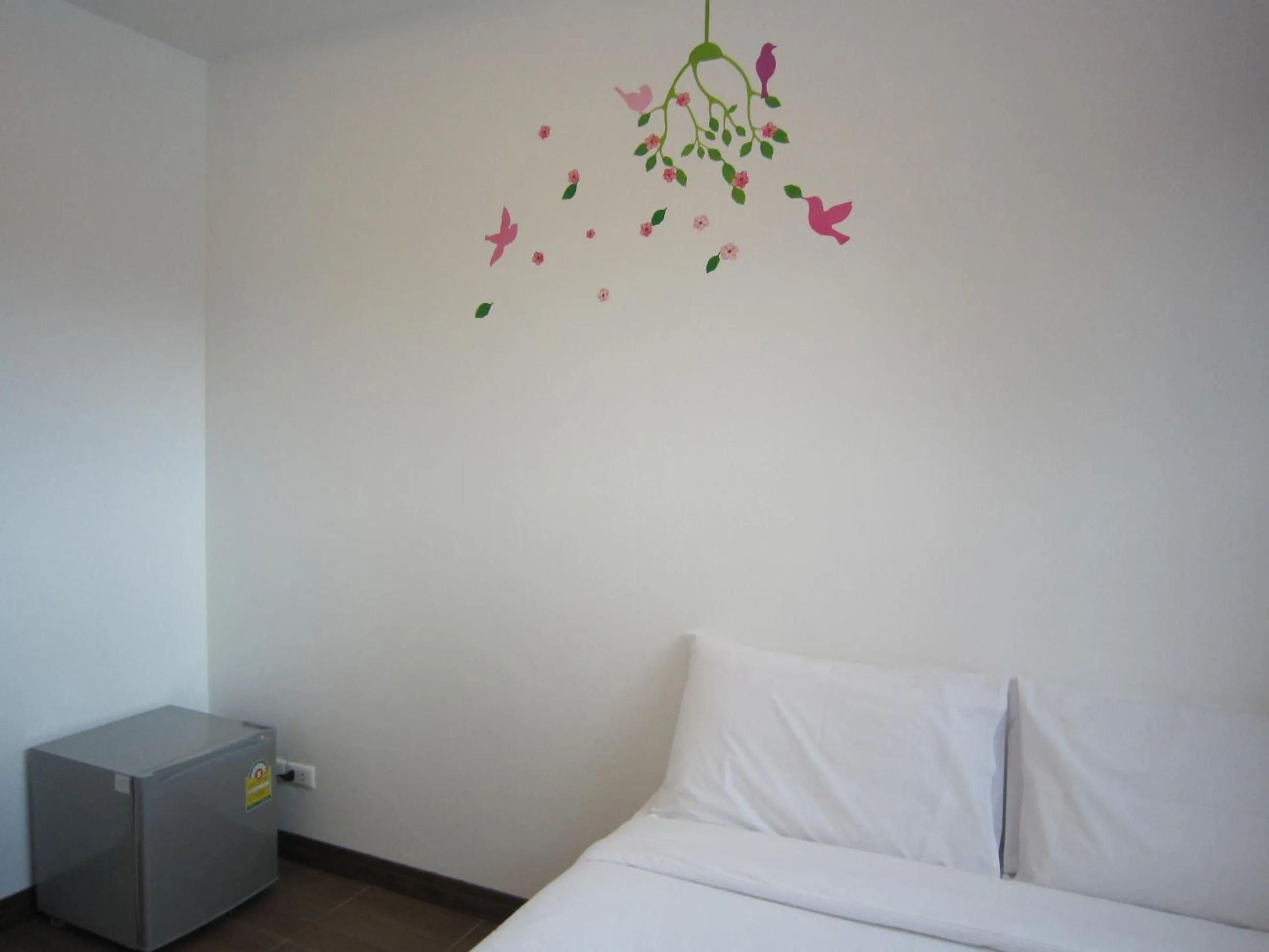 Bed in White Cat Hotel