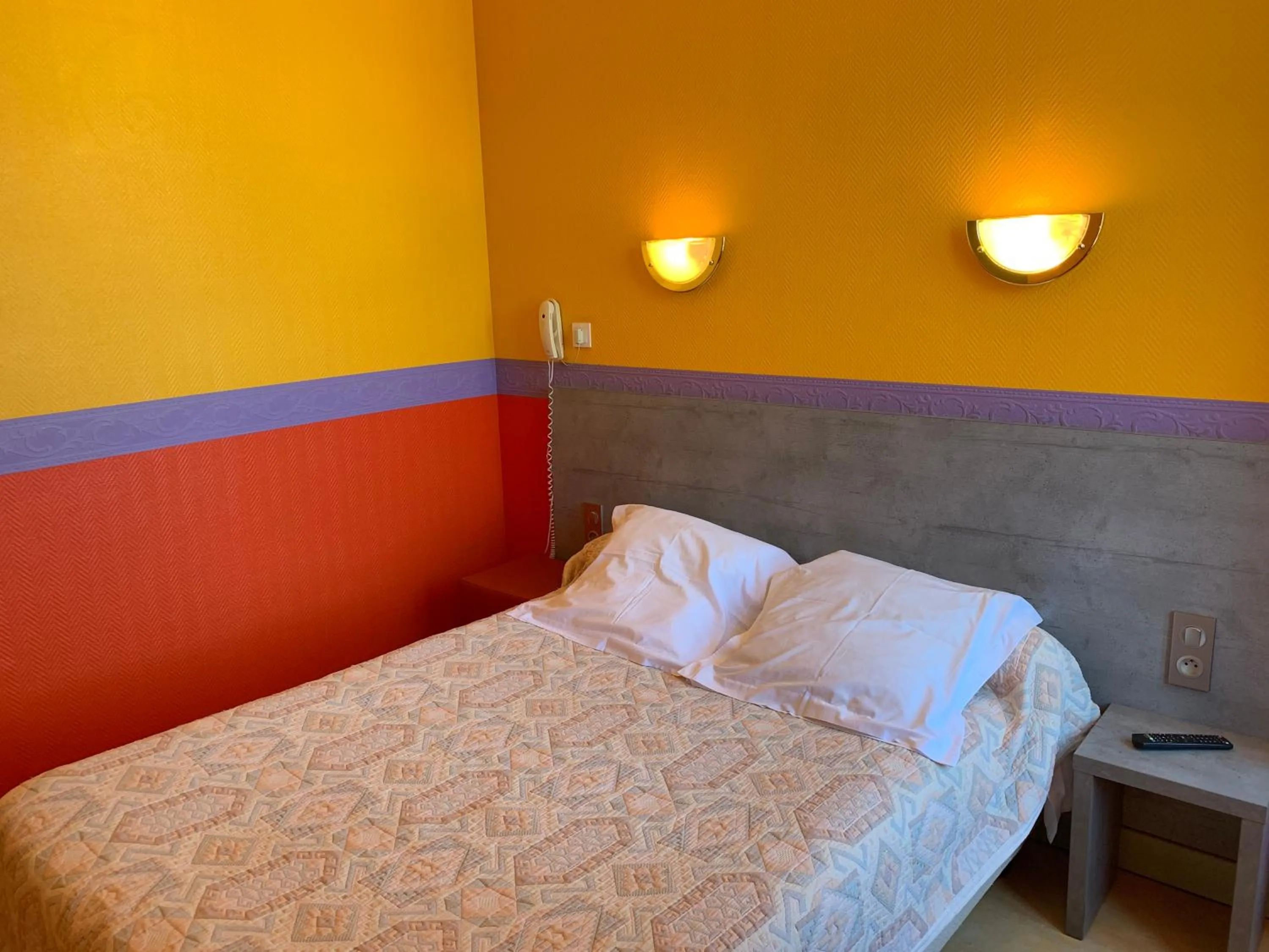 Bed in Hotel des voyageurs Chez Betty