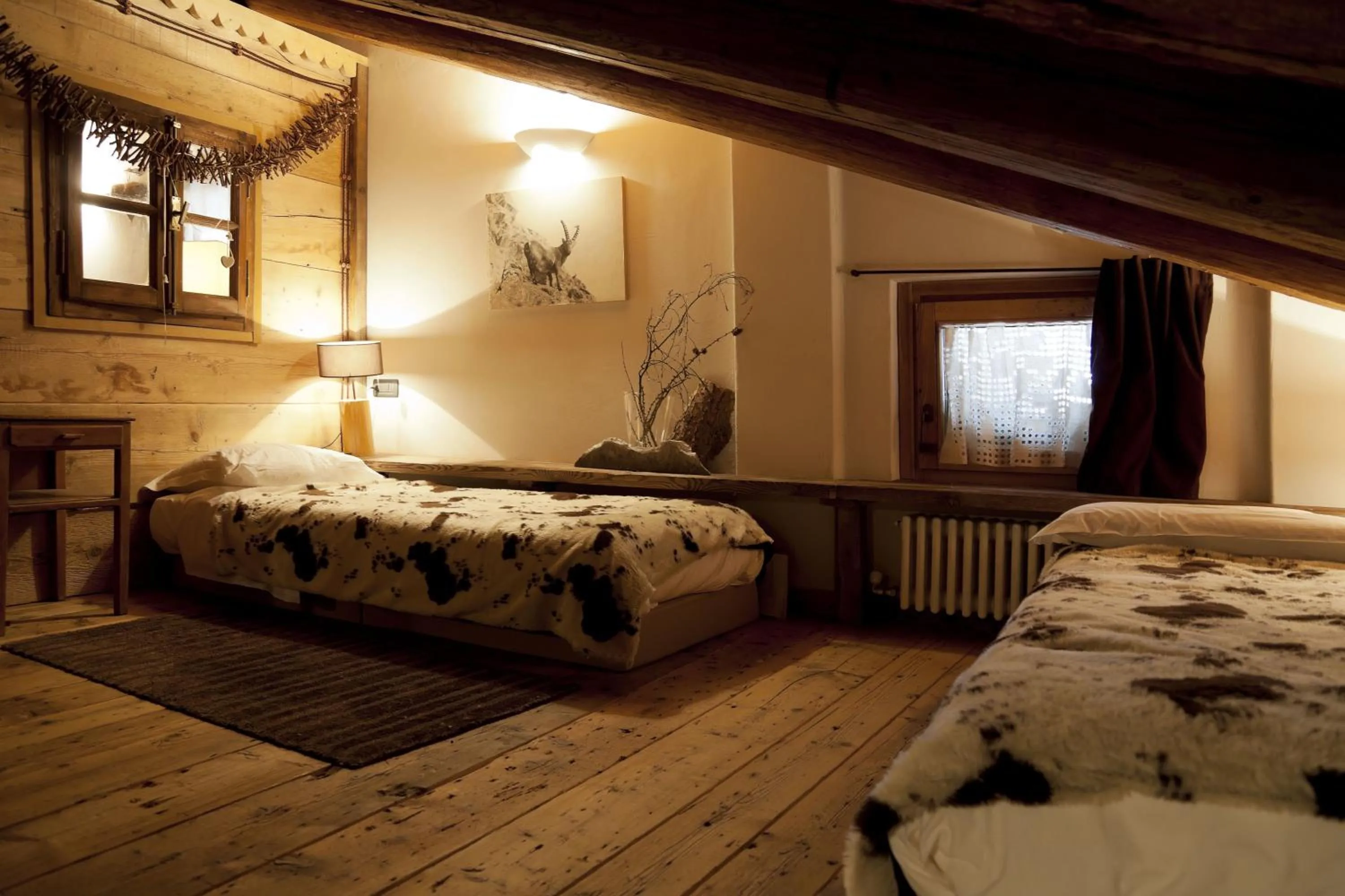 Photo of the whole room, Bed in Chalet Svizzero