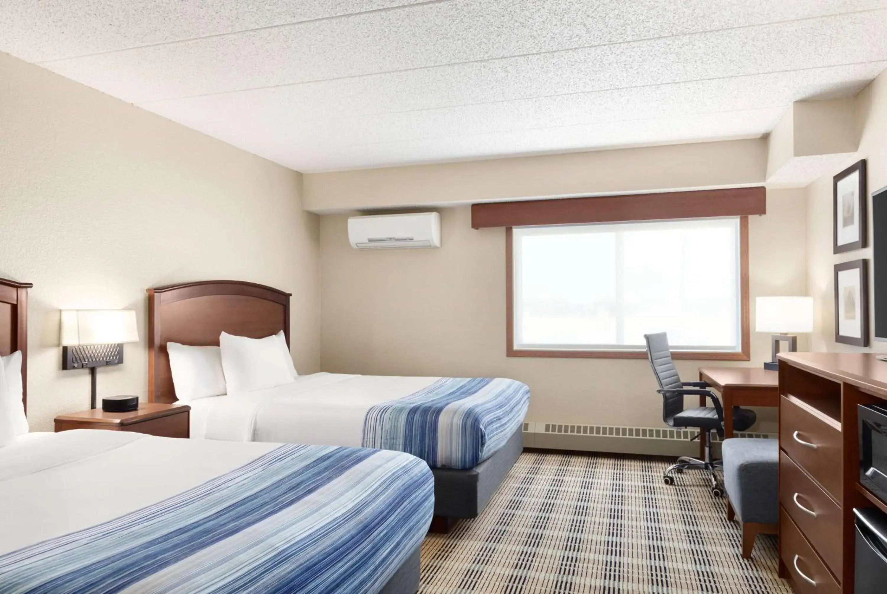 Queen Room with Two Queen Beds - Non-Smoking in AmericInn by Wyndham Roseau Queen Room with Two Queen Beds - Non-Smoking in AmericInn by Wyndham Roseau