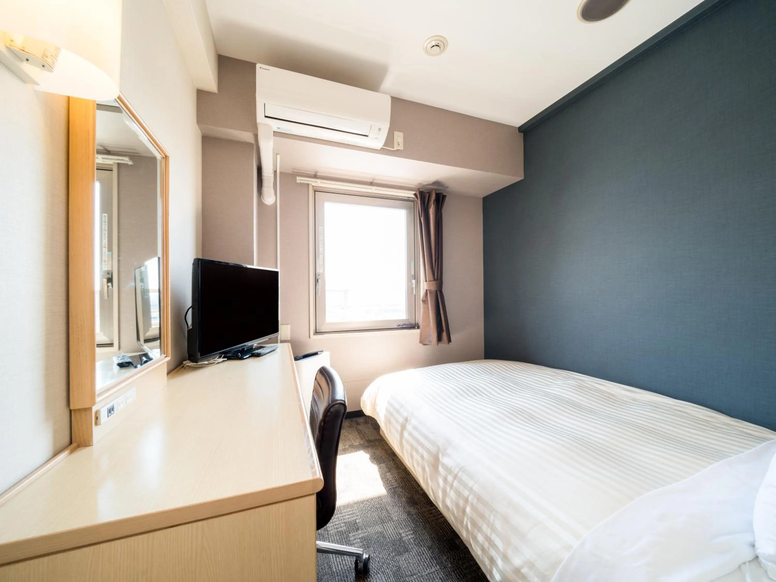 Bed in Super Hotel Osaka Natural Hot Springs