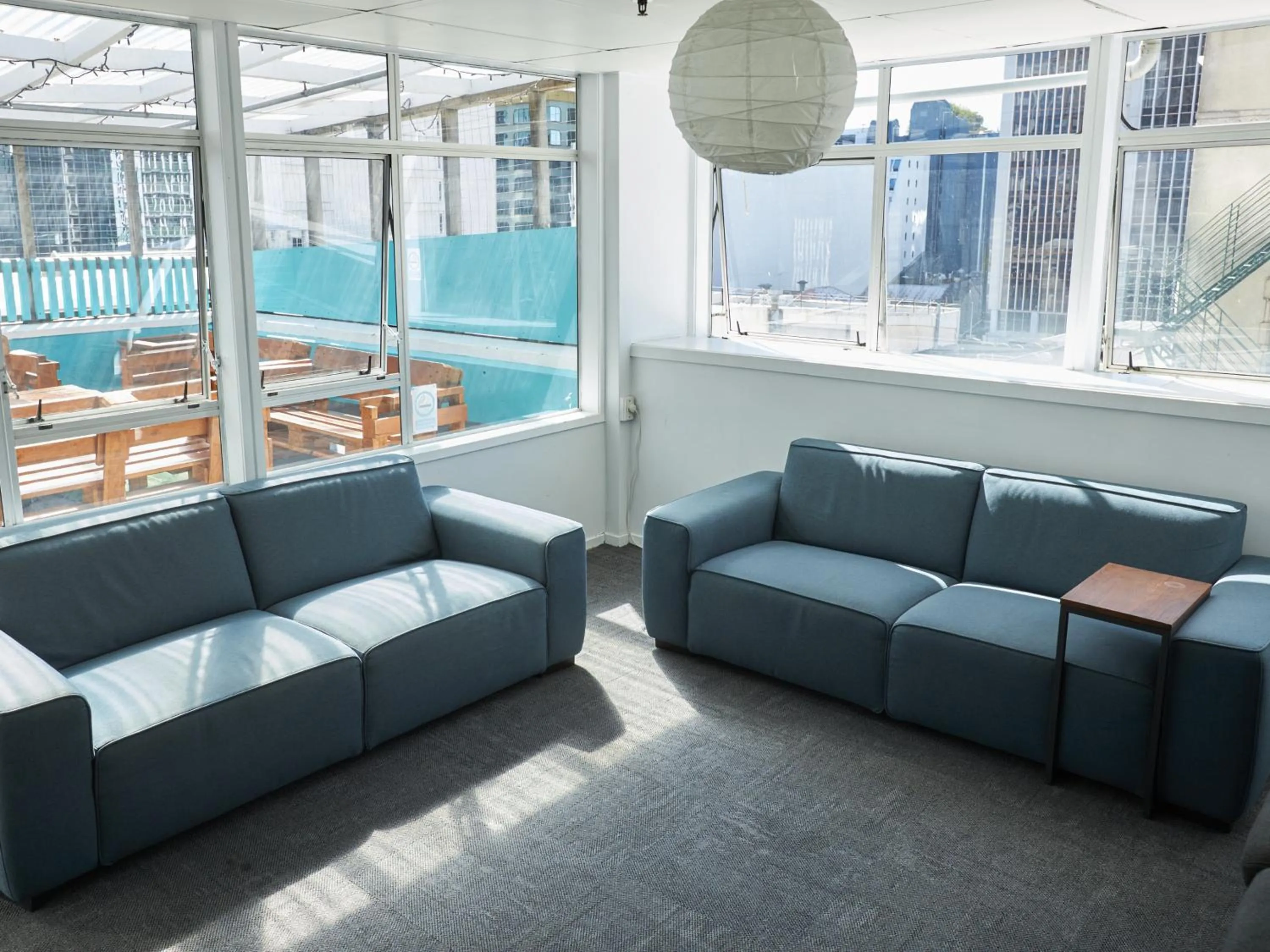 Communal lounge/ TV room in Attic Backpackers