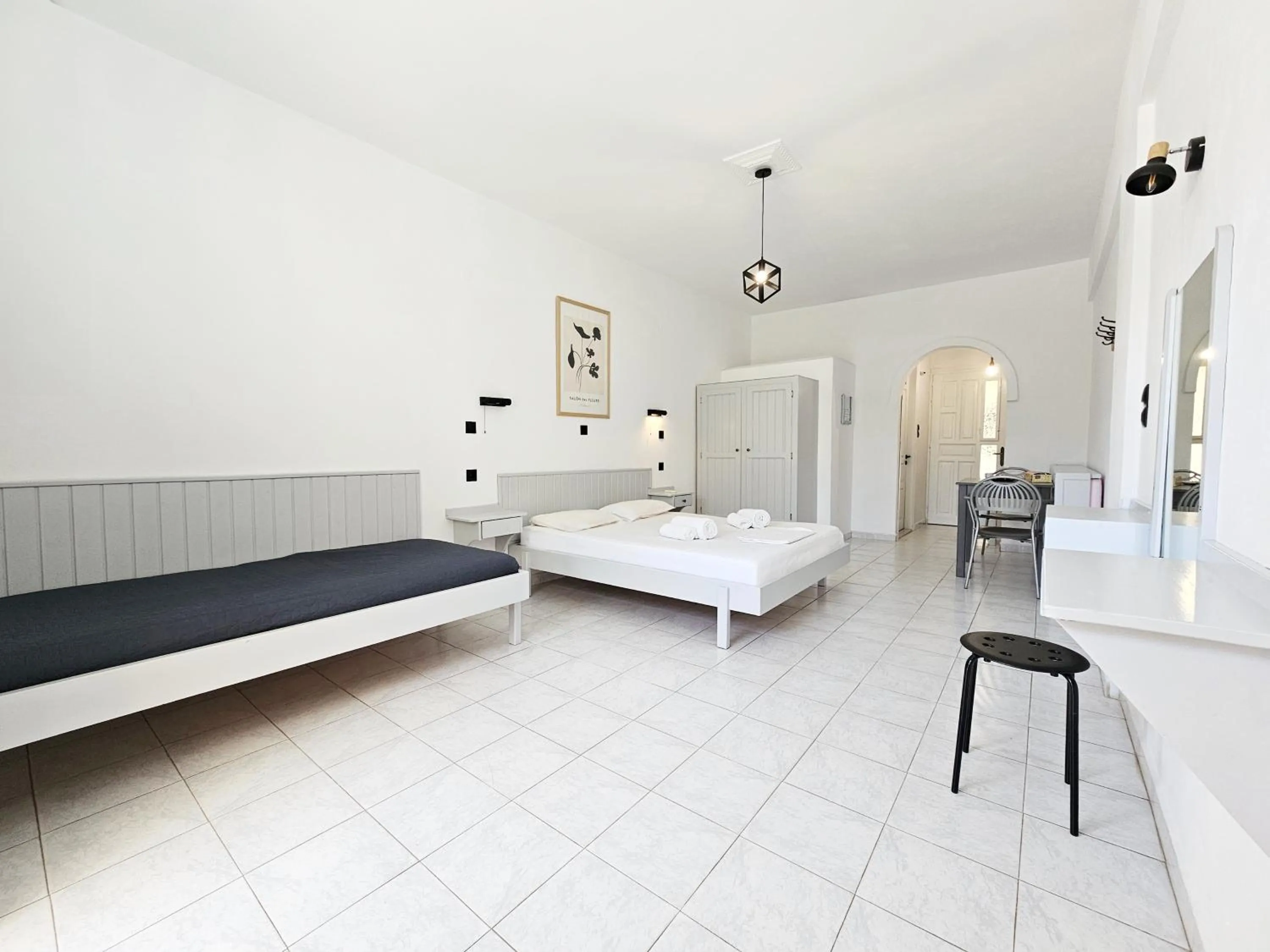 Bed in Pavlis Studios Kampos