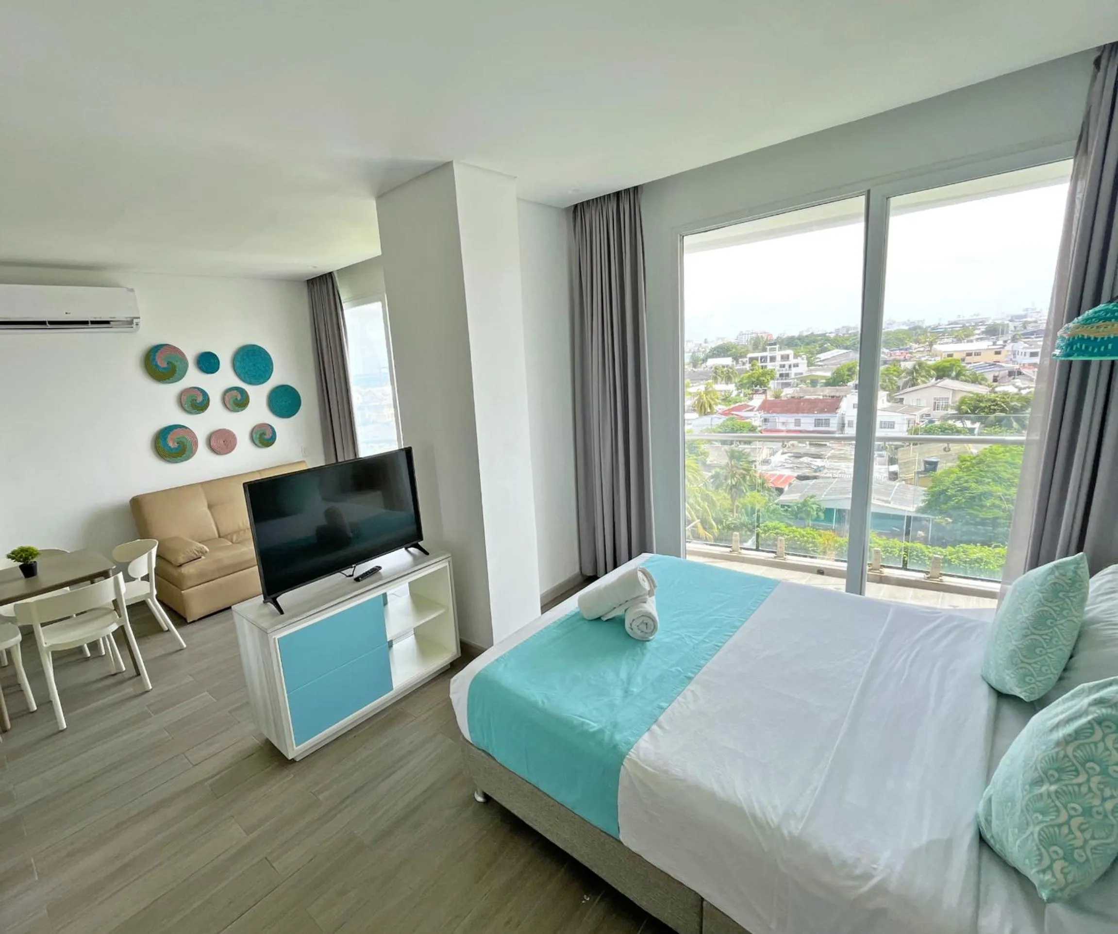 Communal lounge/ TV room, Bed in Azure Lofts & Pool