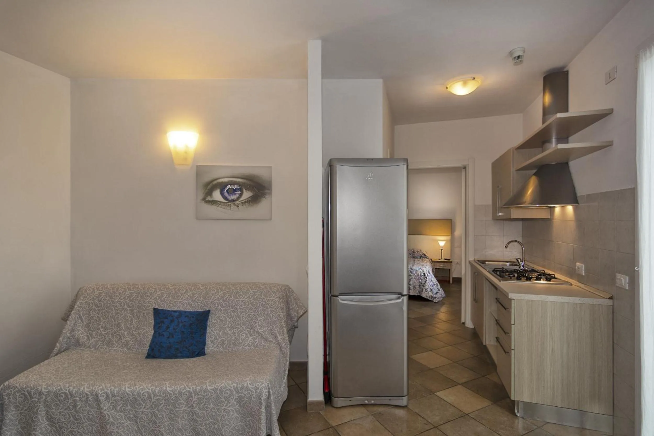 Kitchen or kitchenette, Bed in Eden Park Resort