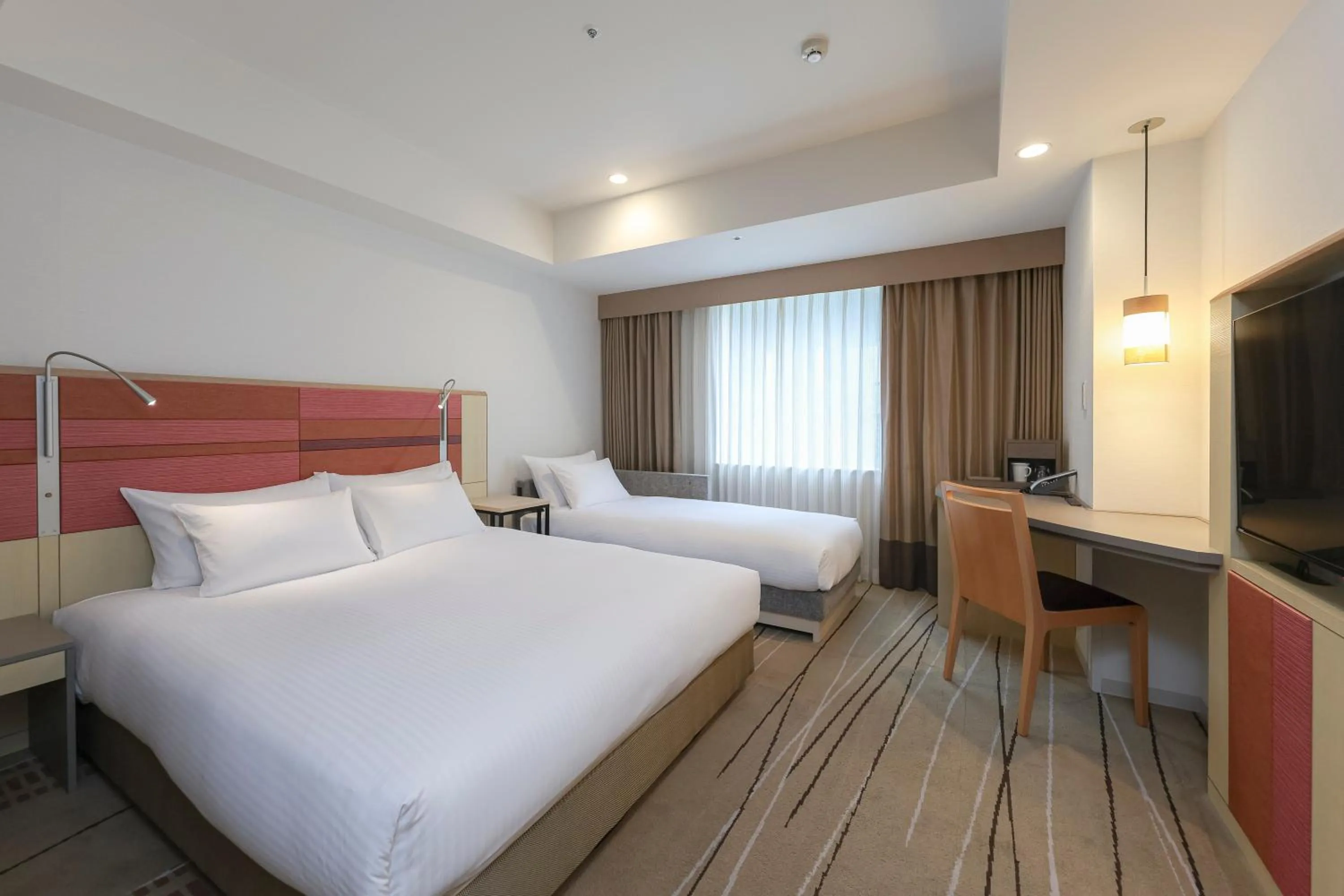 Bed in JR Kyushu Hotel Blossom Hakata Central