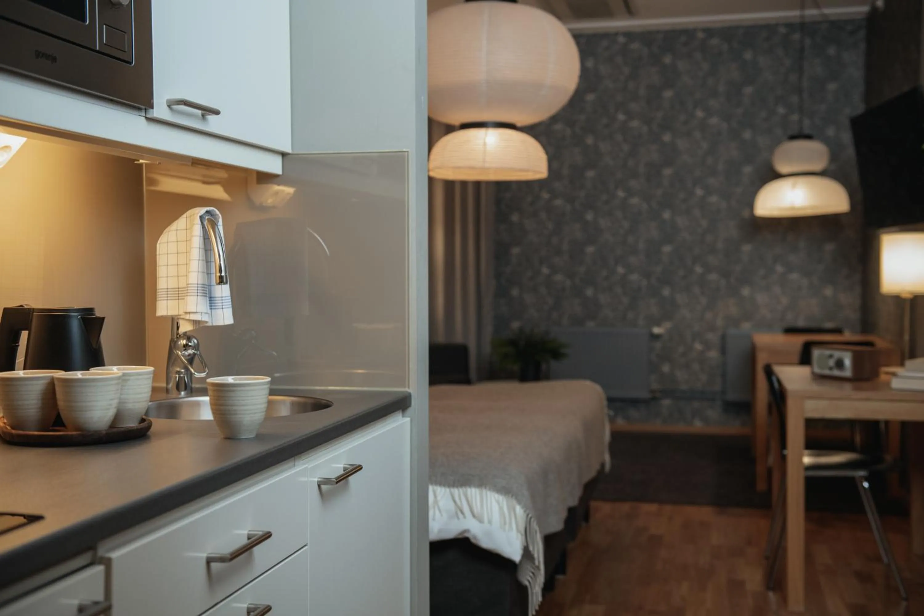 Kitchen or kitchenette, Bed in Home Hotel Mektagonen