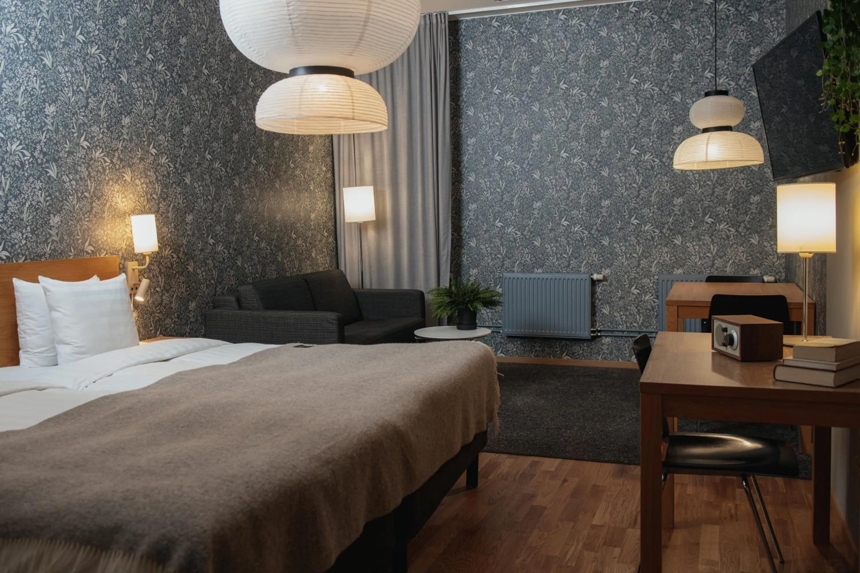 Bed in Home Hotel Mektagonen