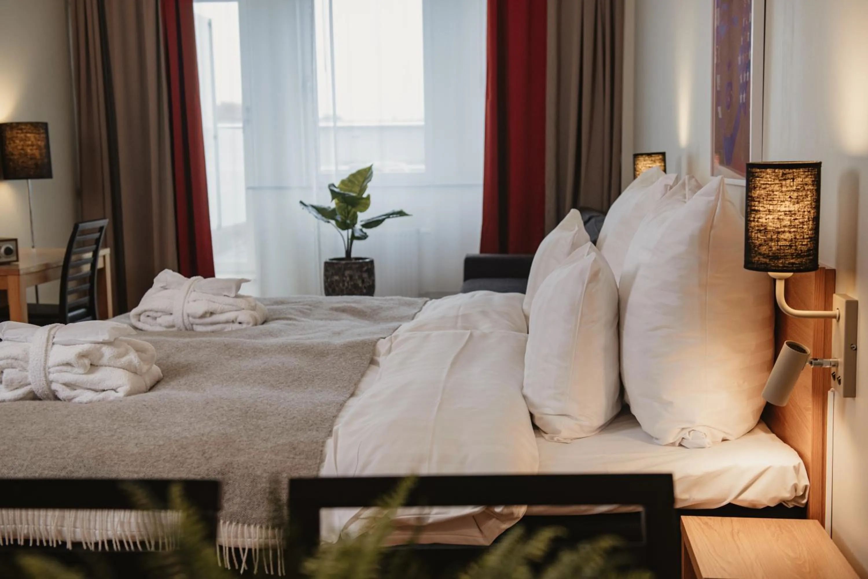 Bed in Home Hotel Mektagonen