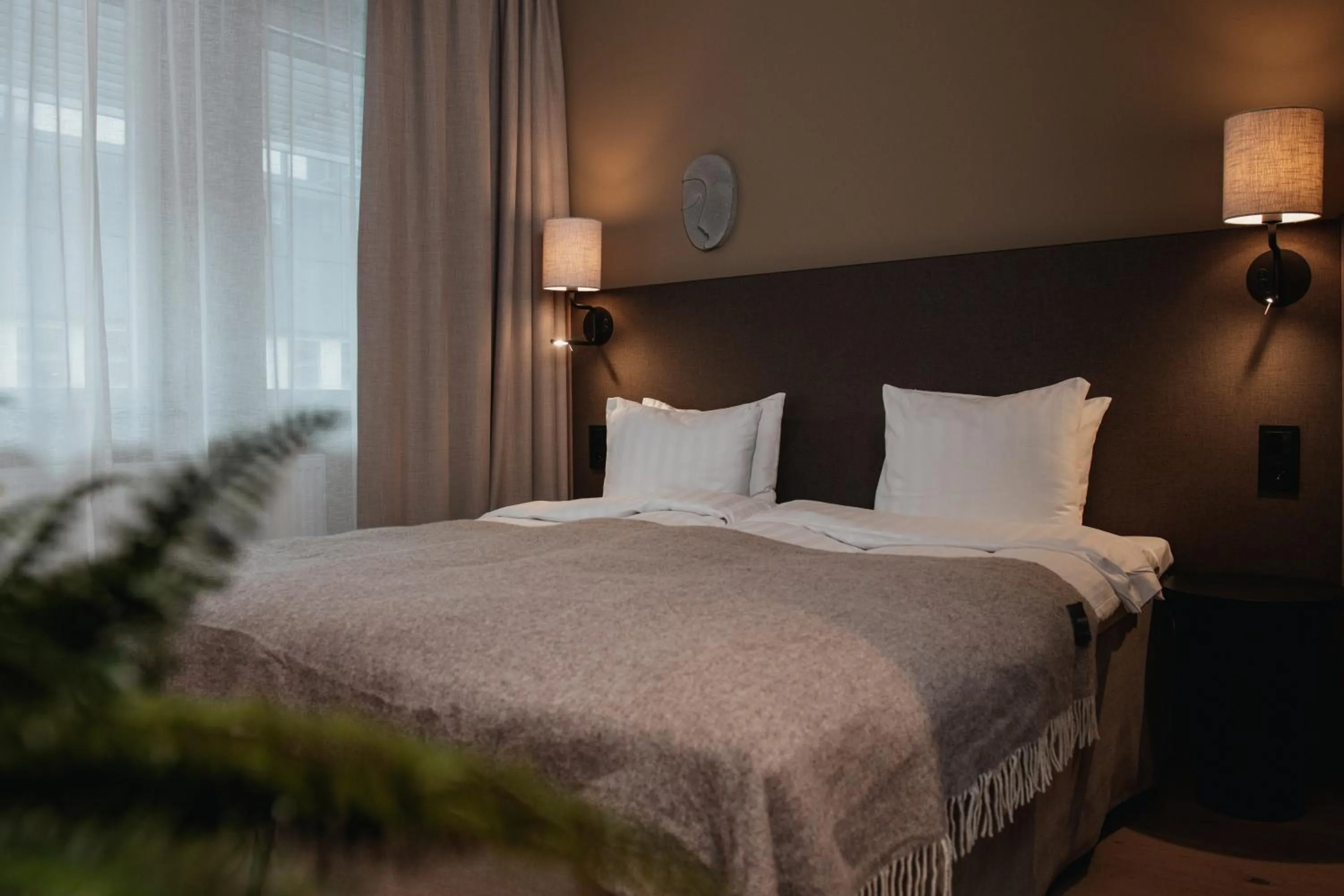 Bed in Home Hotel Mektagonen