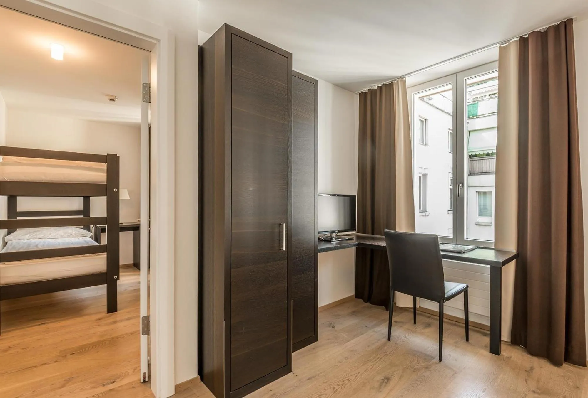 Photo of the whole room, Bed in Hotel Alpina Luzern