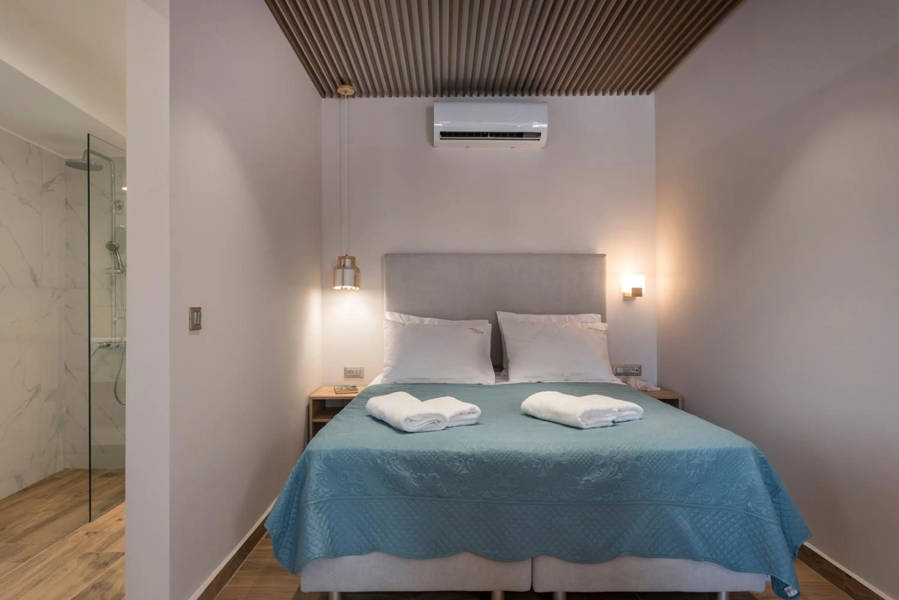 Bed in Aequor Luxury Rooms & Apartments