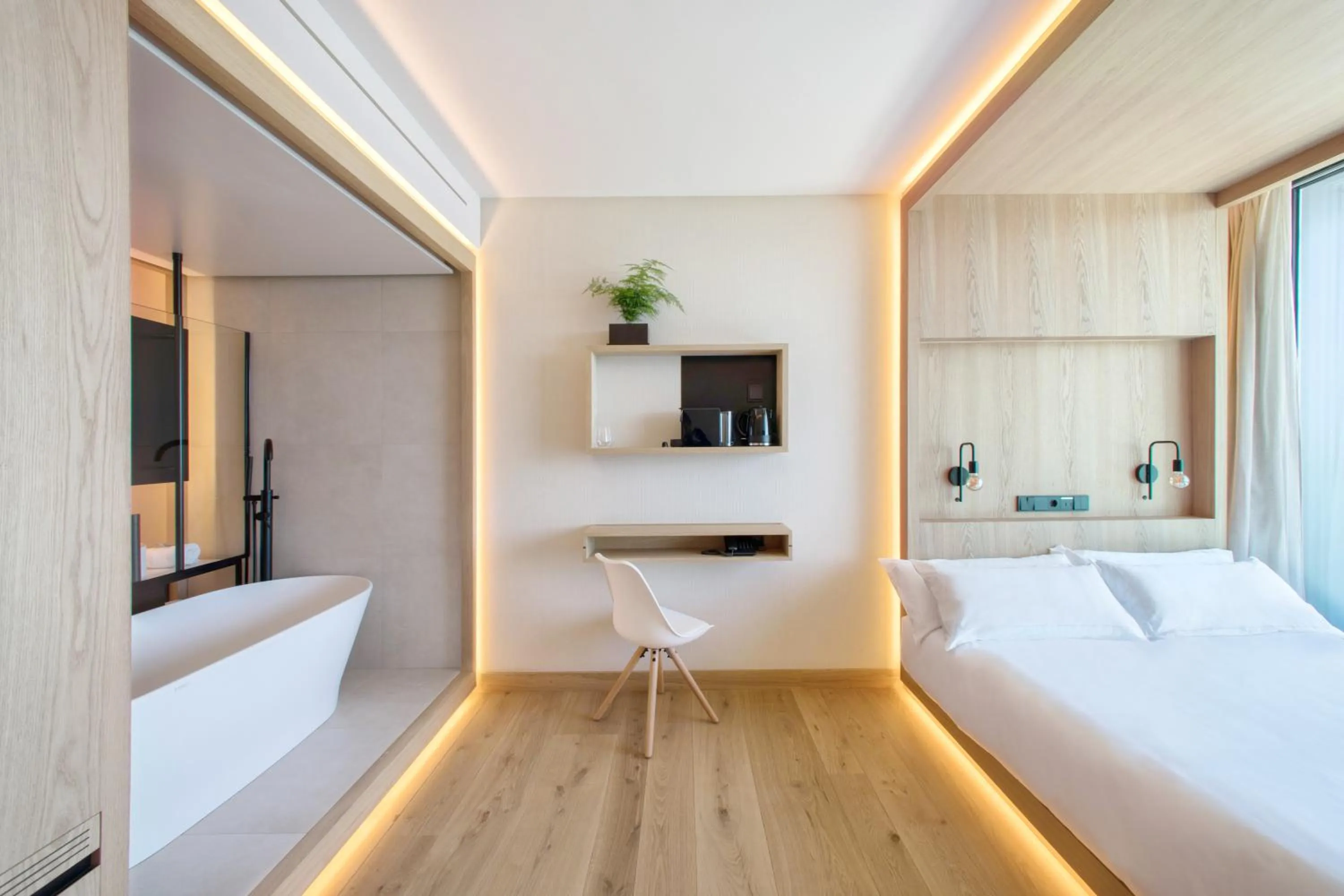 Seating area, Bed in Noa Boutique Hotel