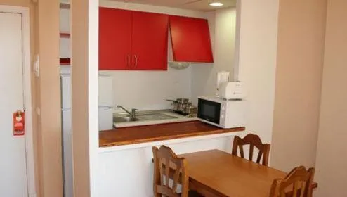 Kitchen or kitchenette in Apartamentos Martha's