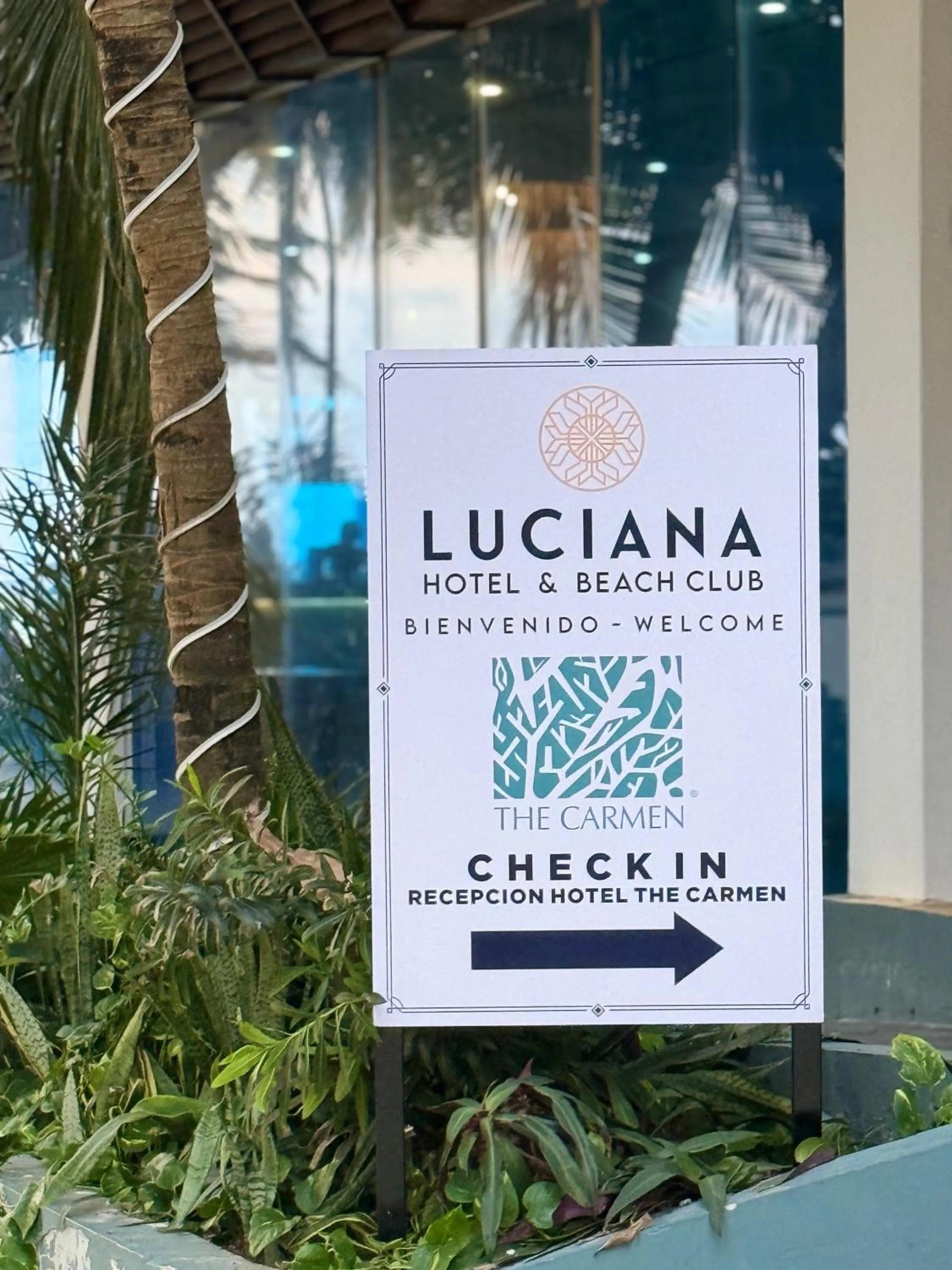 Property logo or sign in Luciana Hotel & Beach Club
