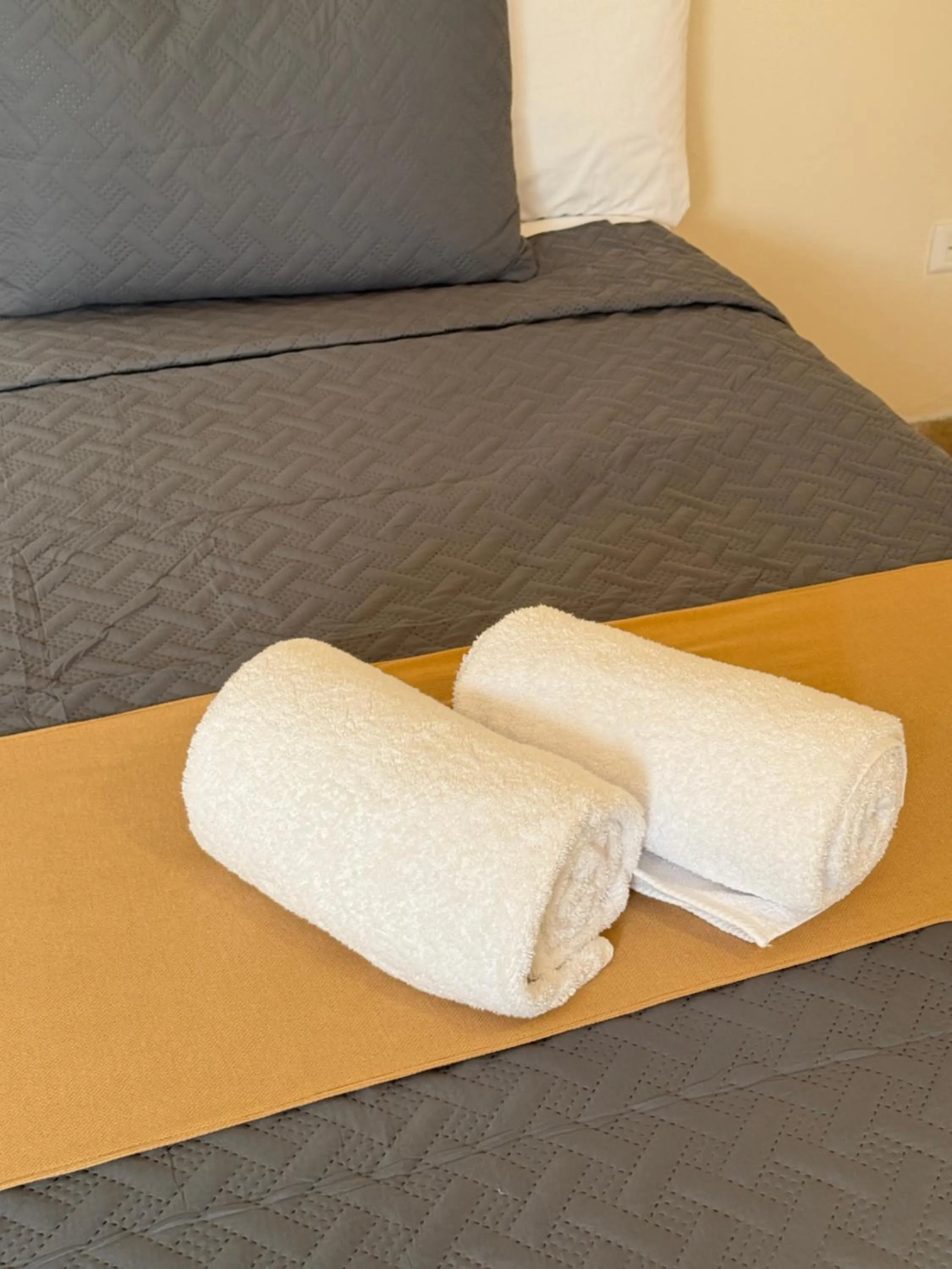 towels, Bed in Luciana Hotel & Beach Club
