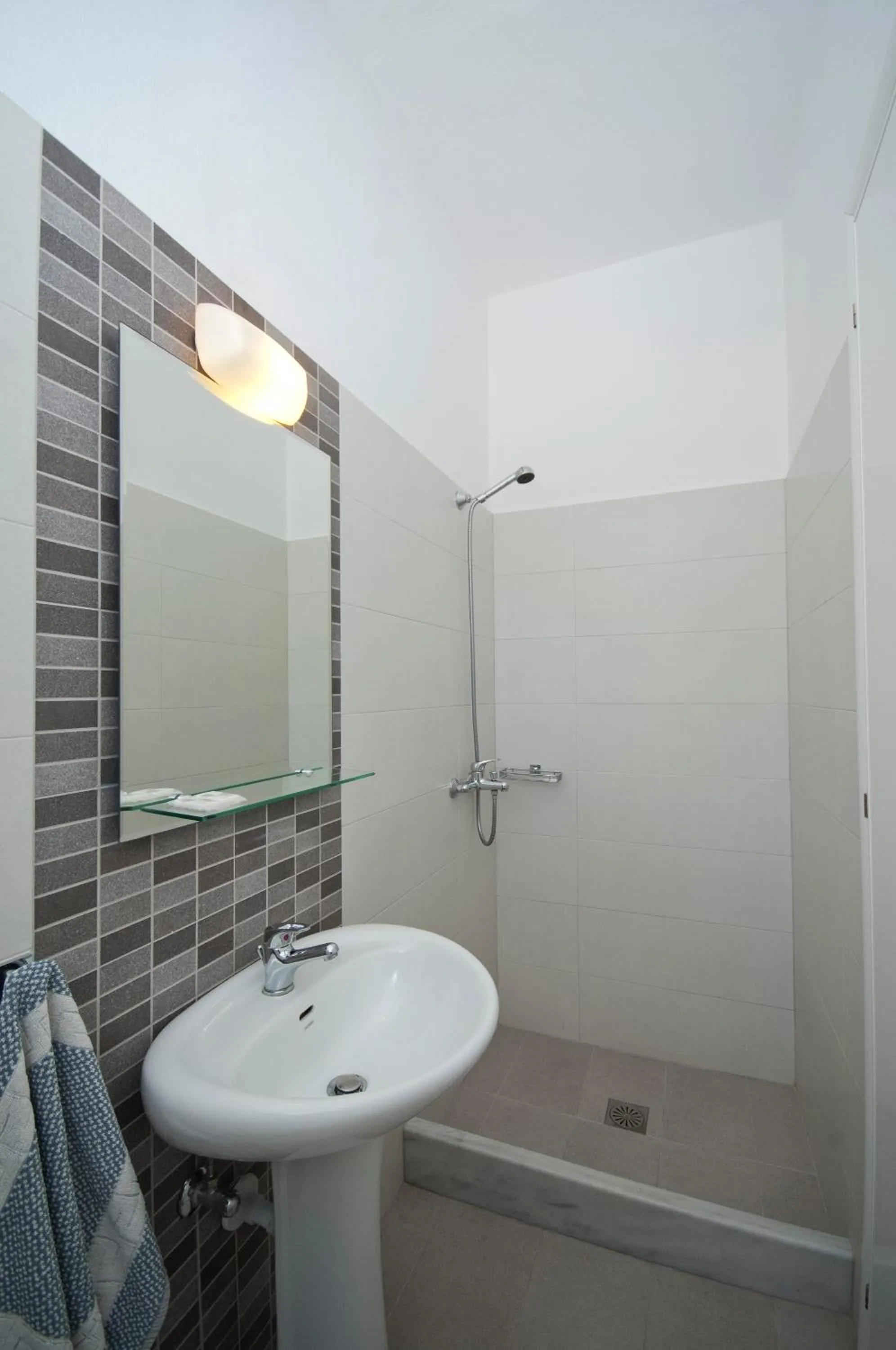 Bathroom in Megas Rooms