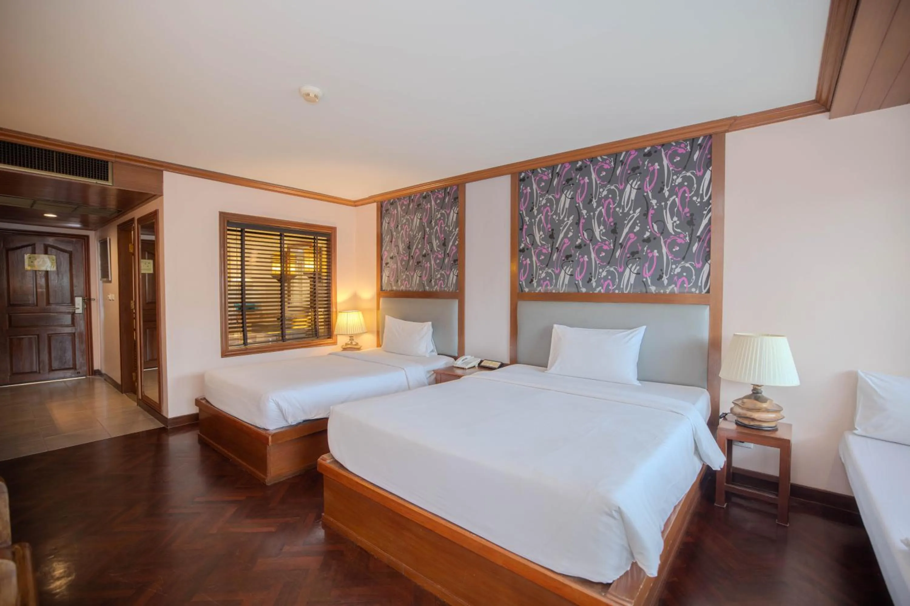 Bed in Baumanburi Hotel Patong