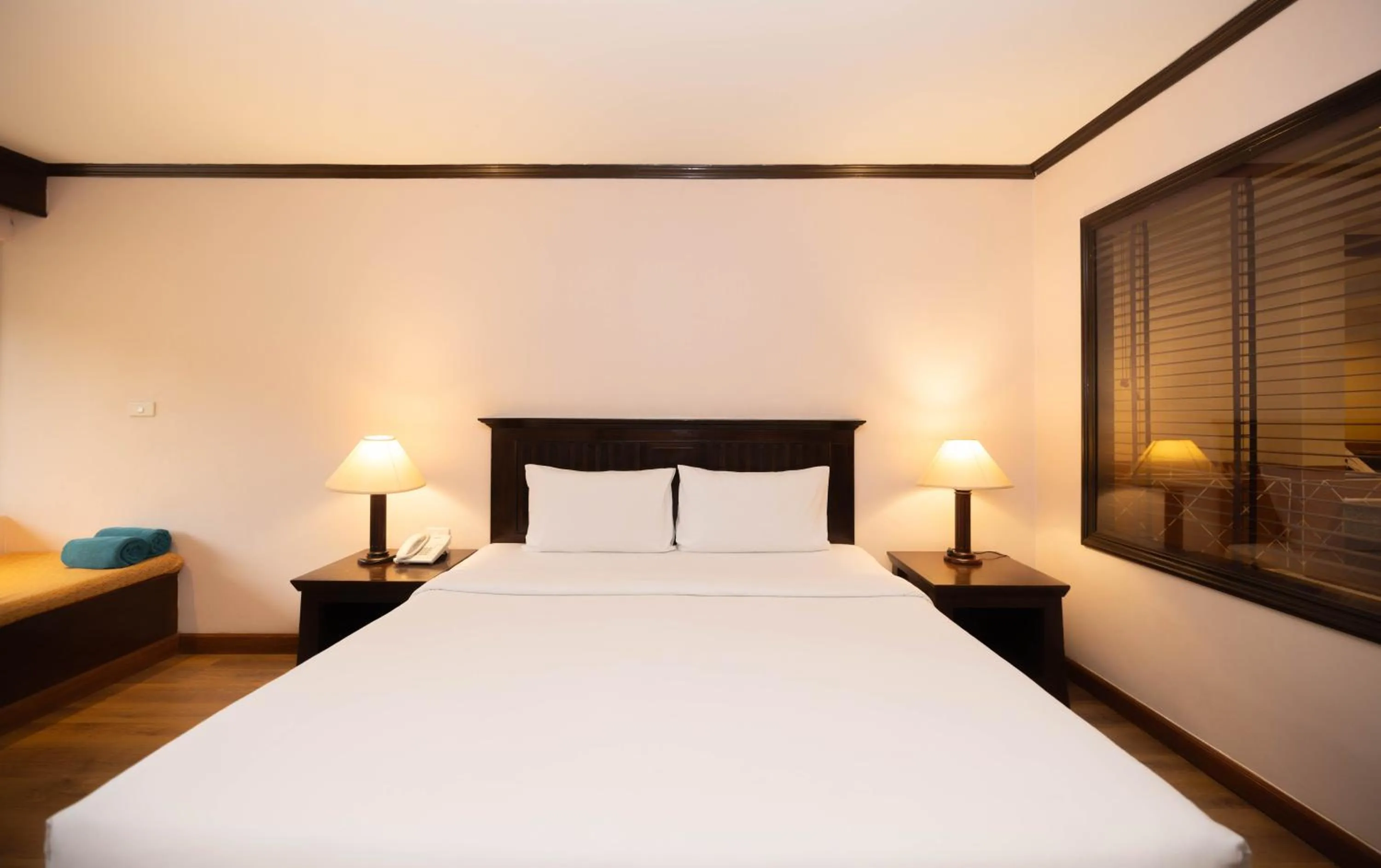 Bed in Baumanburi Hotel Patong