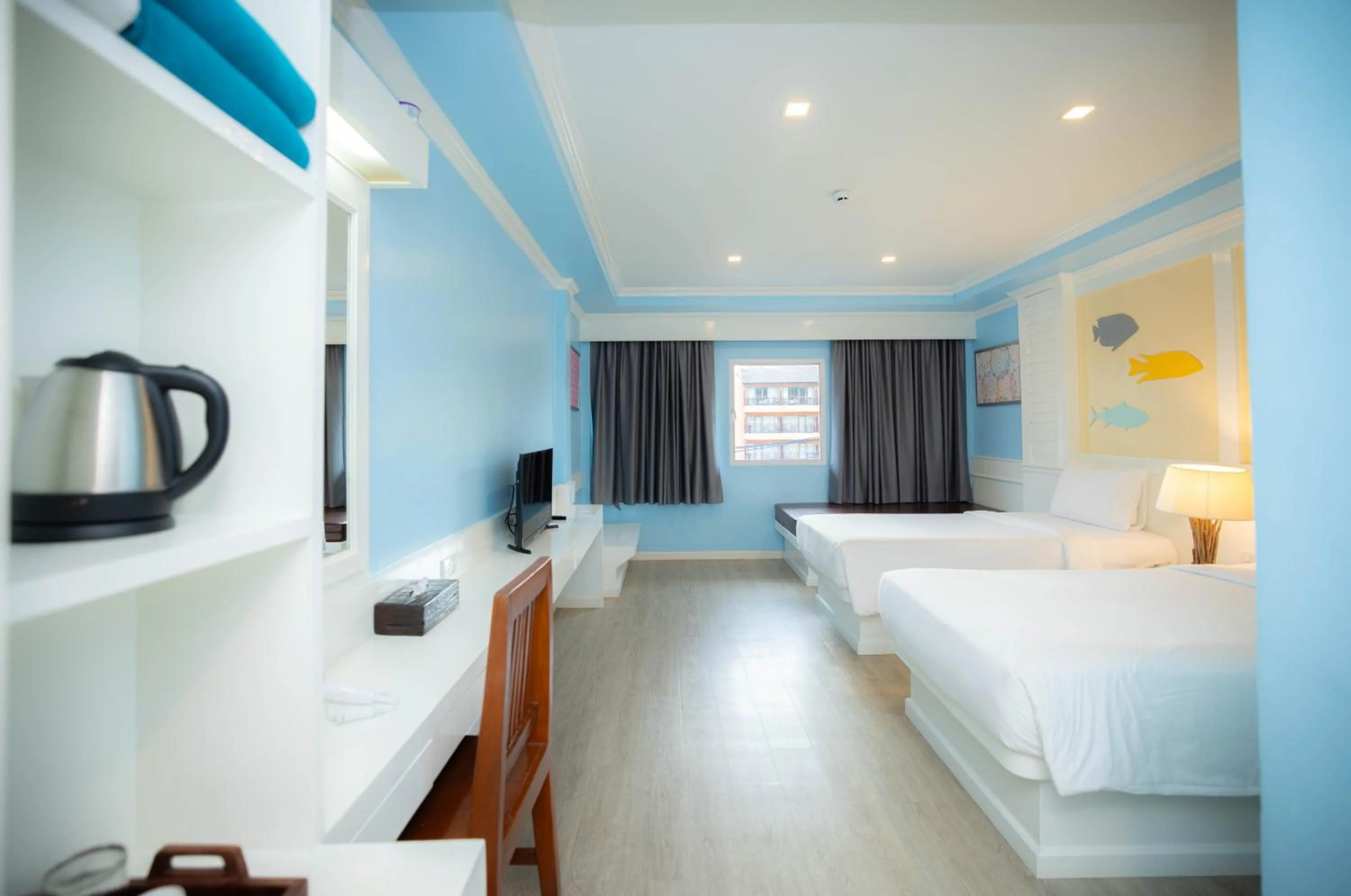 Bed in Baumanburi Hotel Patong
