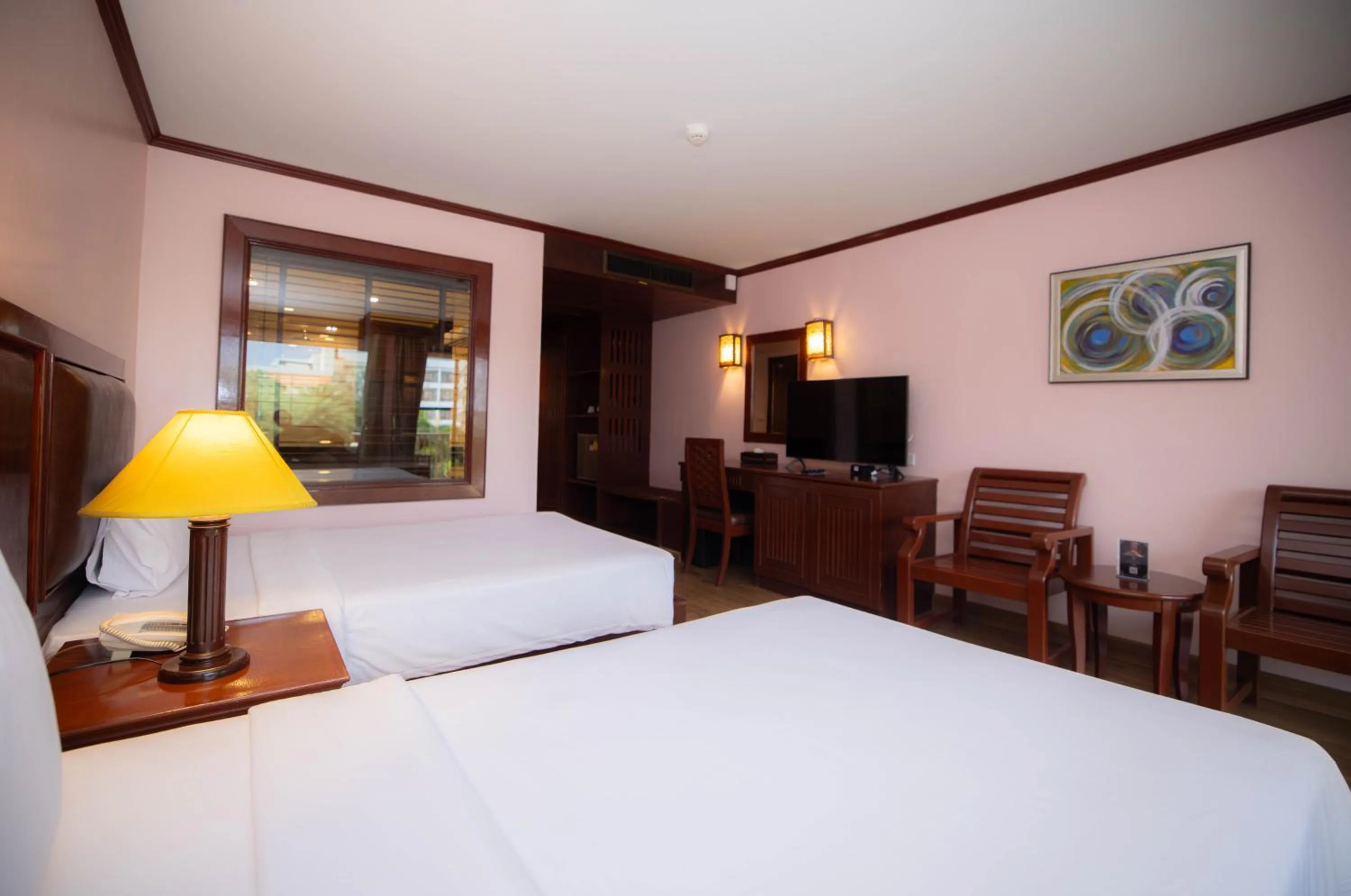Bed in Baumanburi Hotel Patong