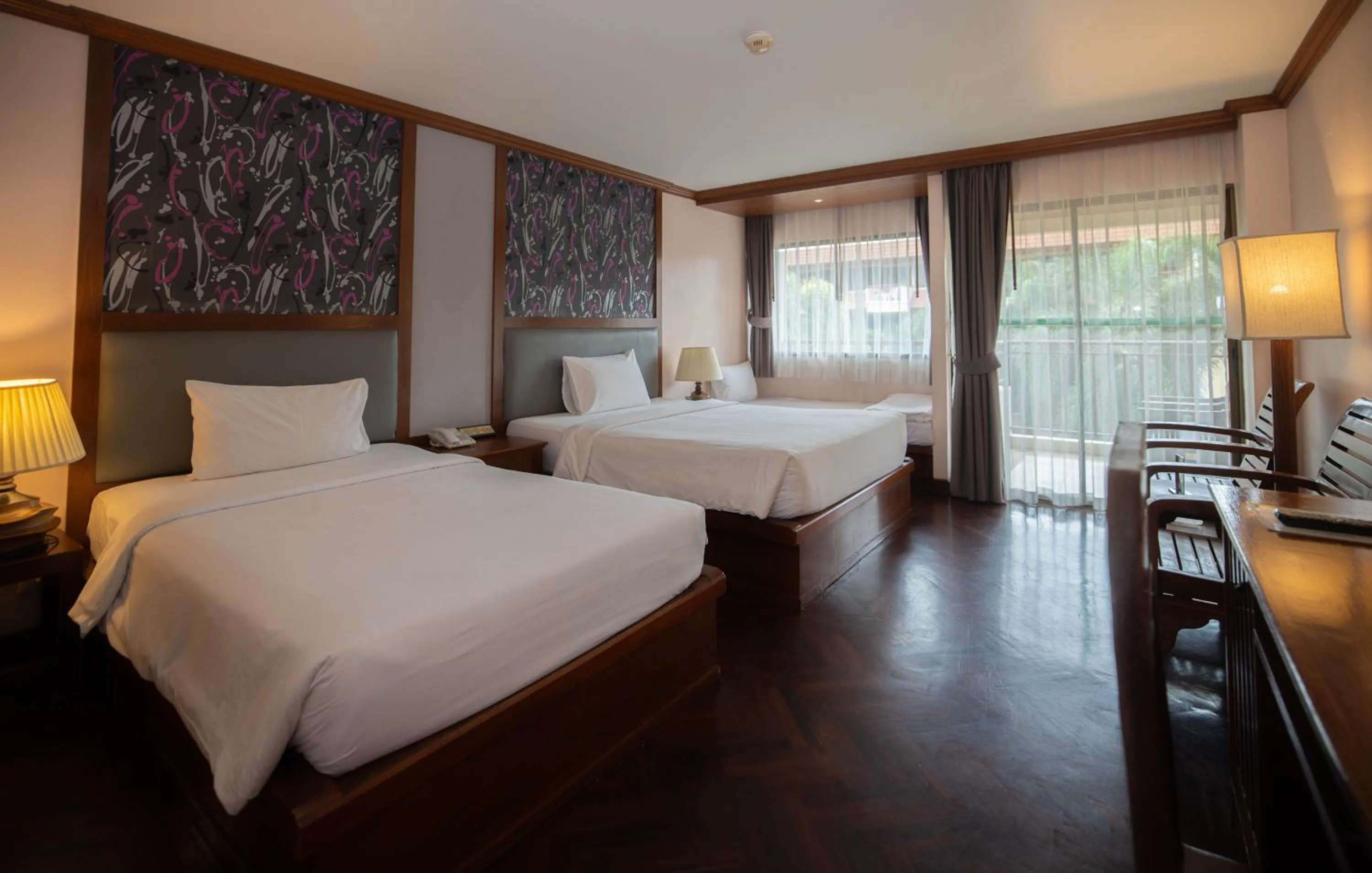 Bed in Baumanburi Hotel Patong