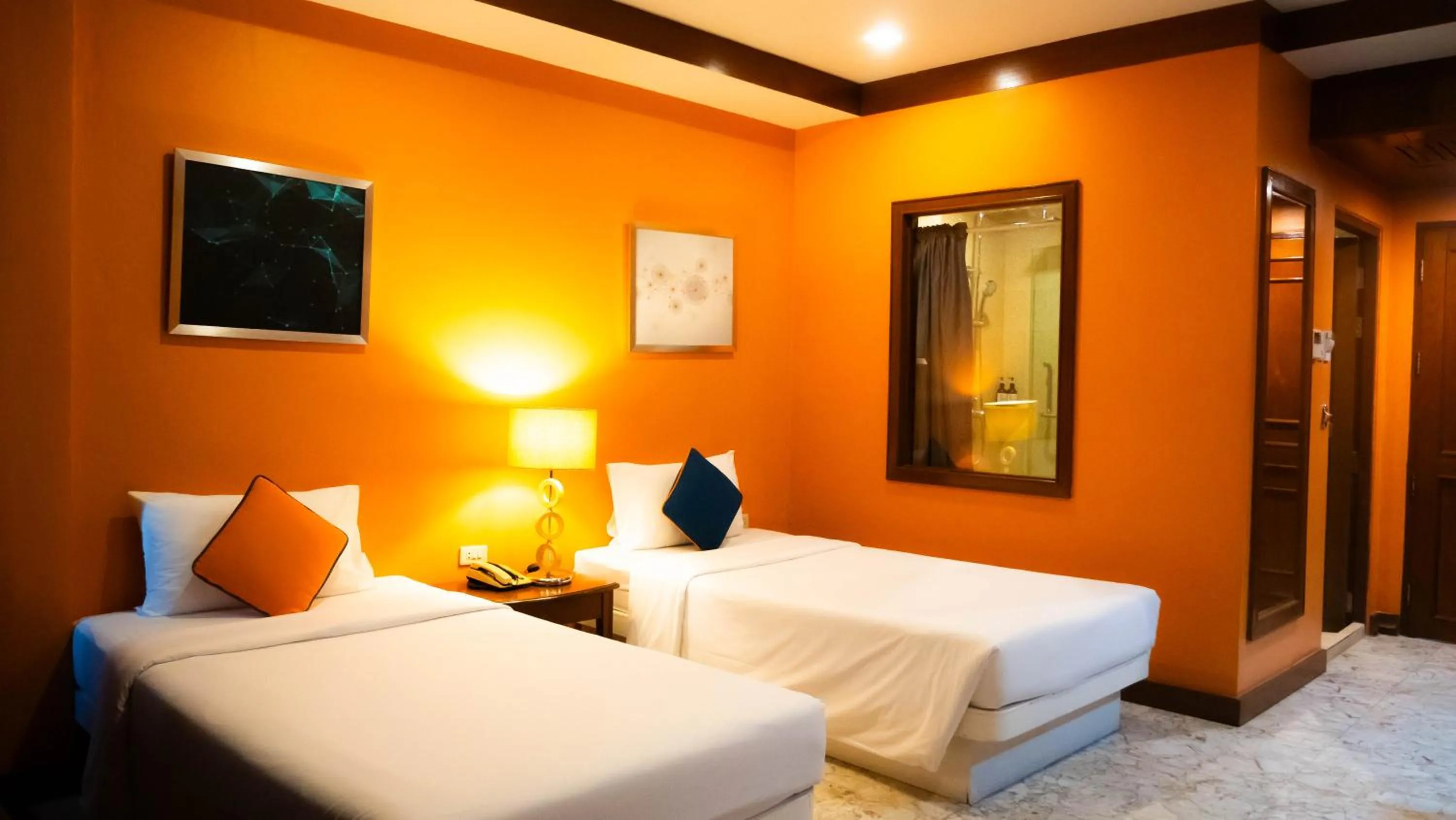 Bed in Baumanburi Hotel Patong