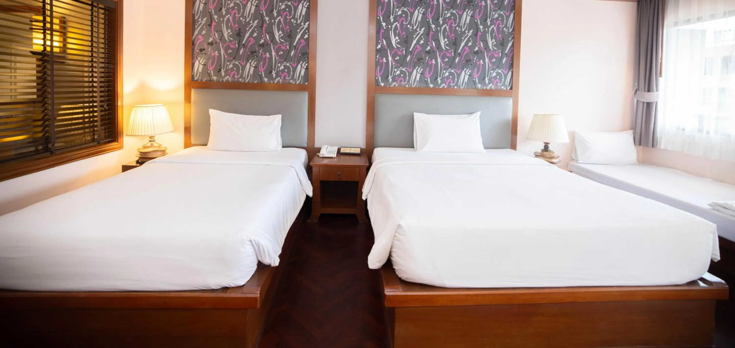 Bed in Baumanburi Hotel Patong