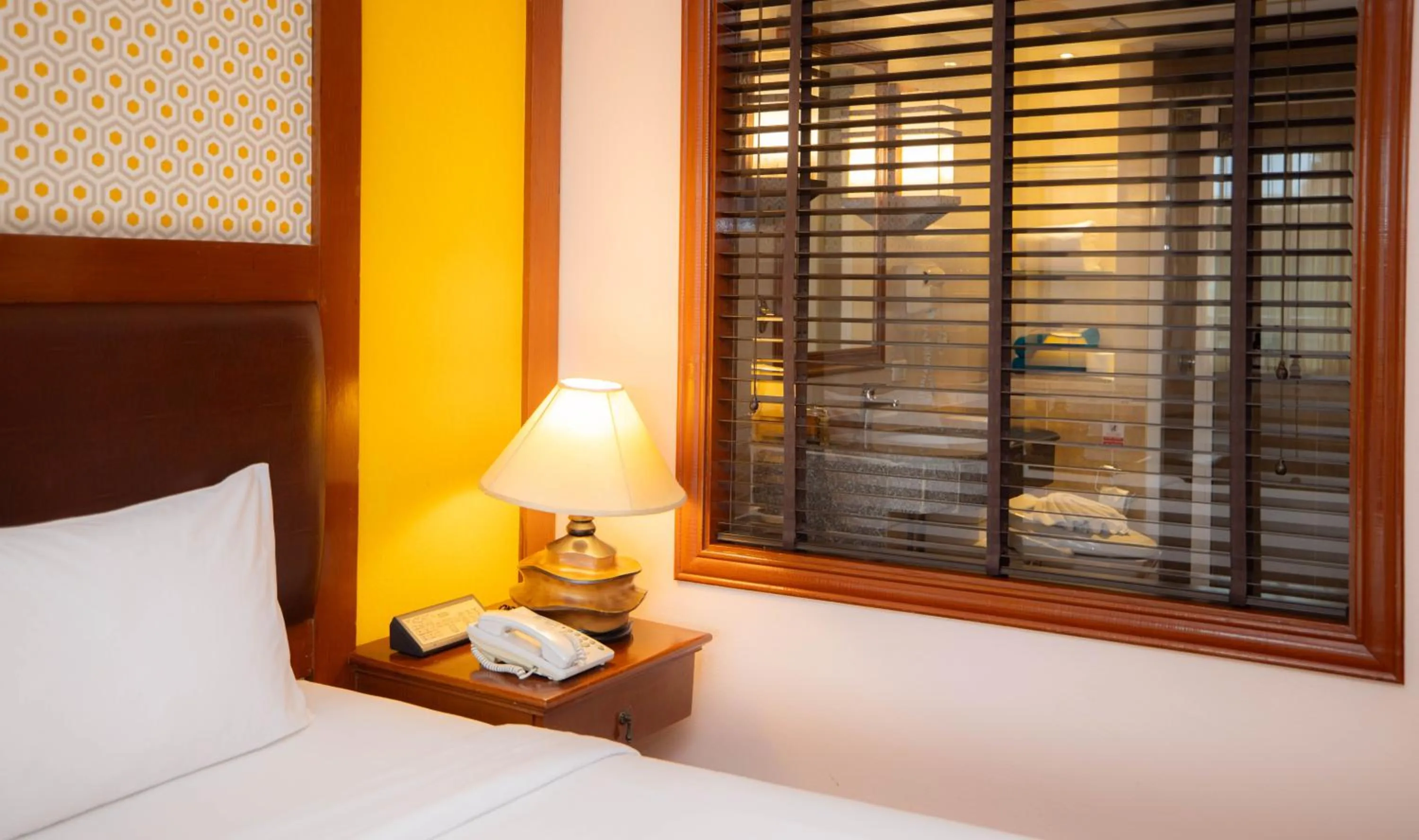 Bed in Baumanburi Hotel Patong