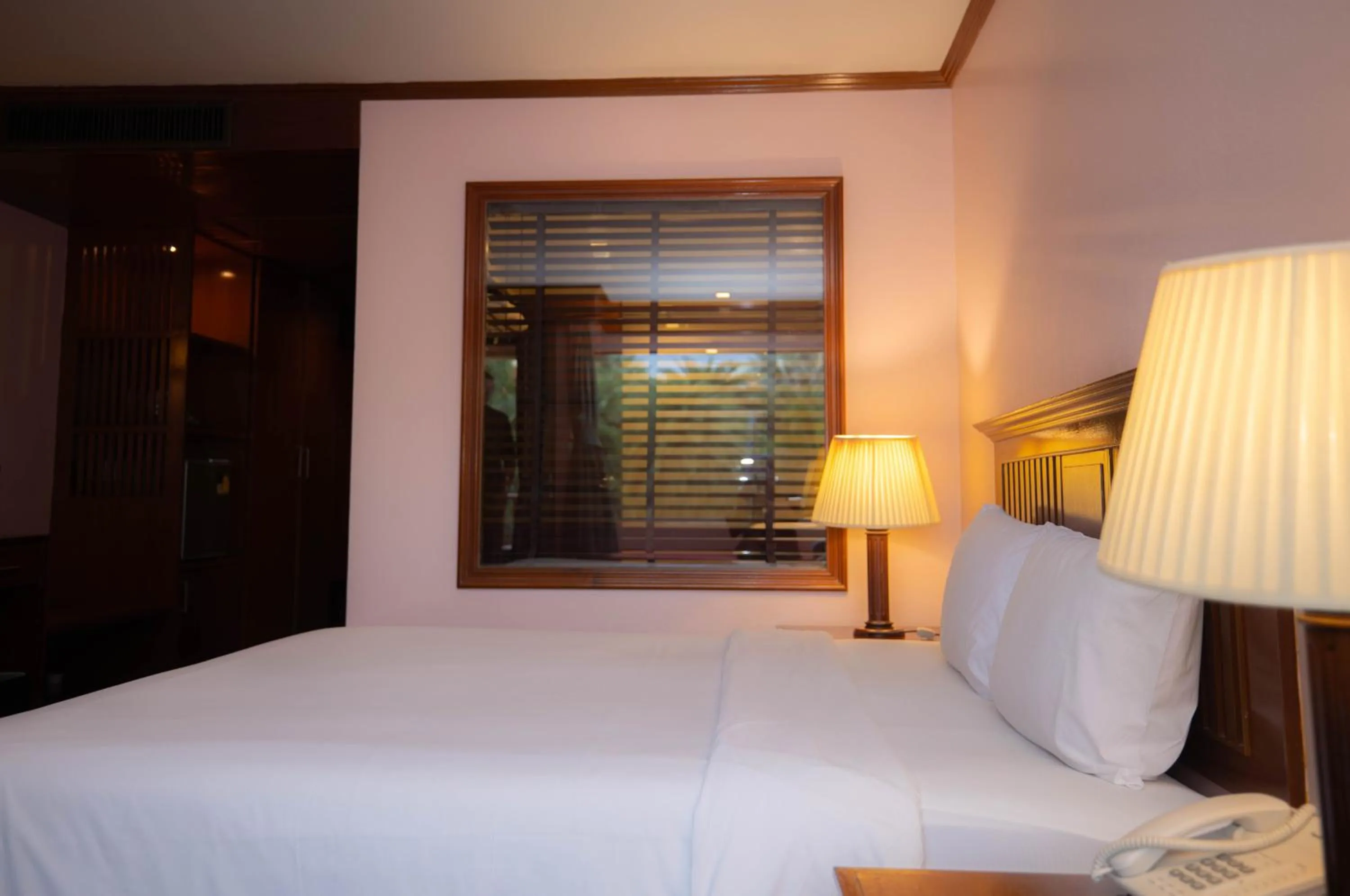 Bed in Baumanburi Hotel Patong