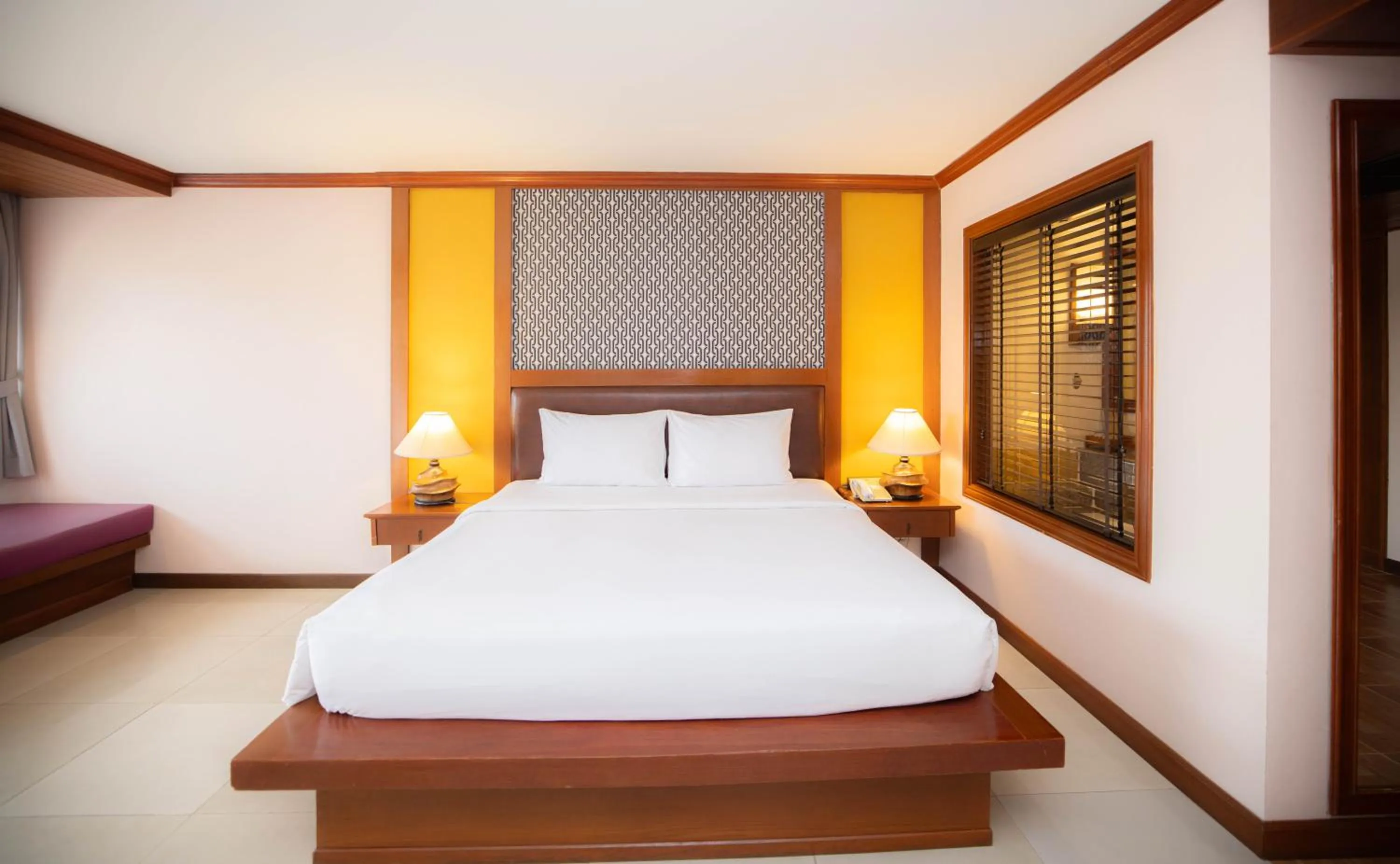 Bed in Baumanburi Hotel Patong