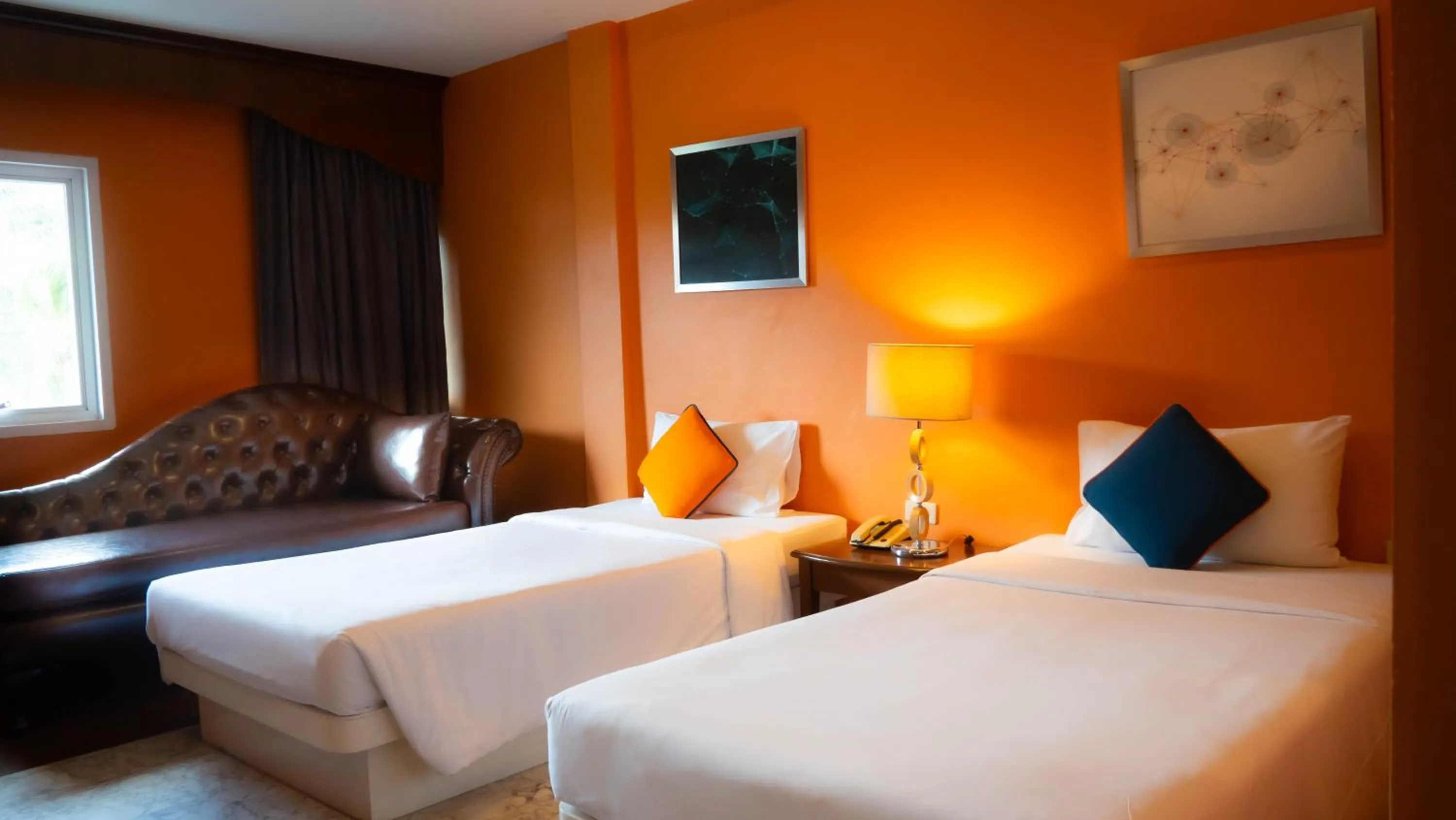 Bed in Baumanburi Hotel Patong