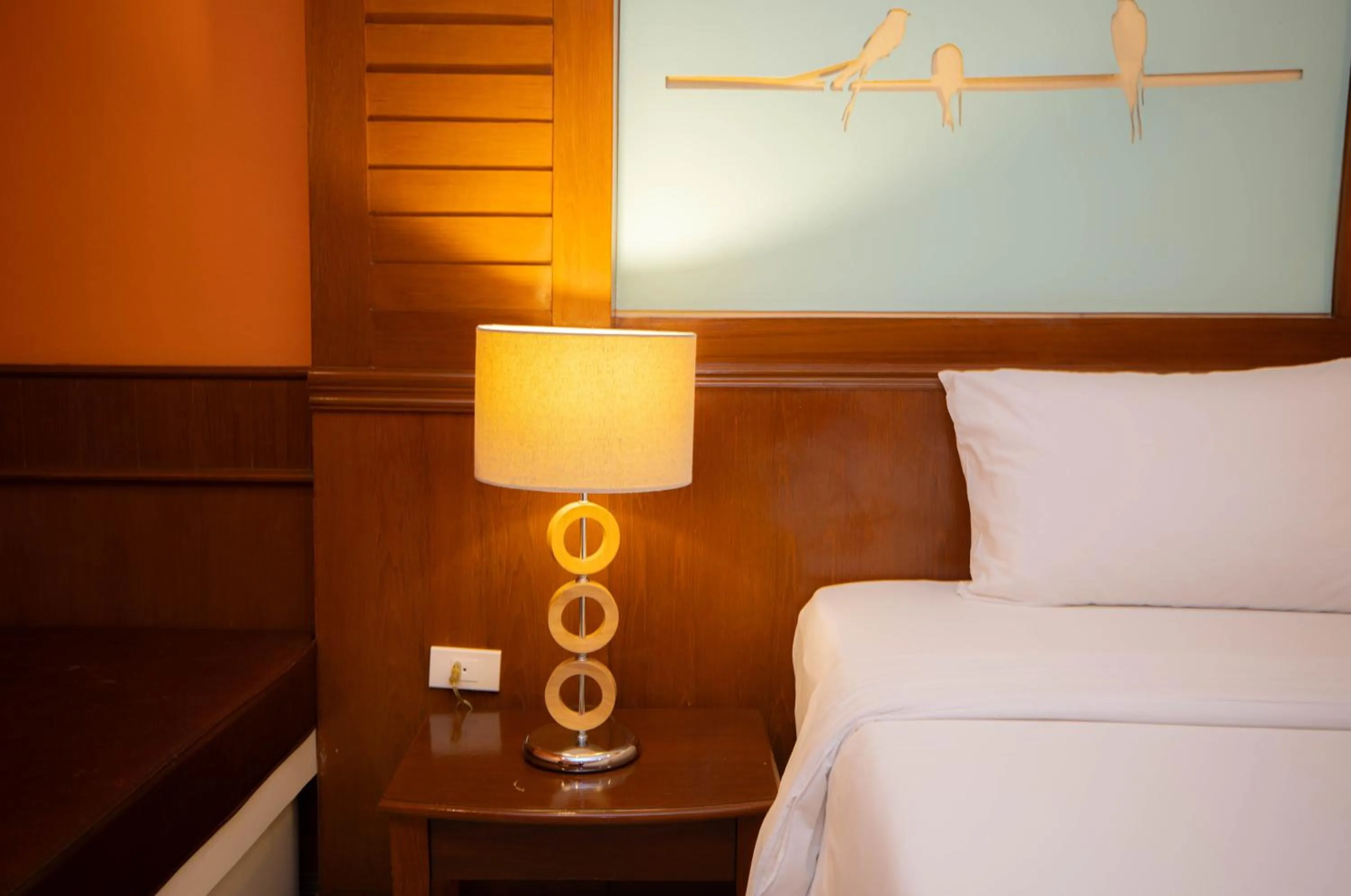 Bed in Baumanburi Hotel Patong