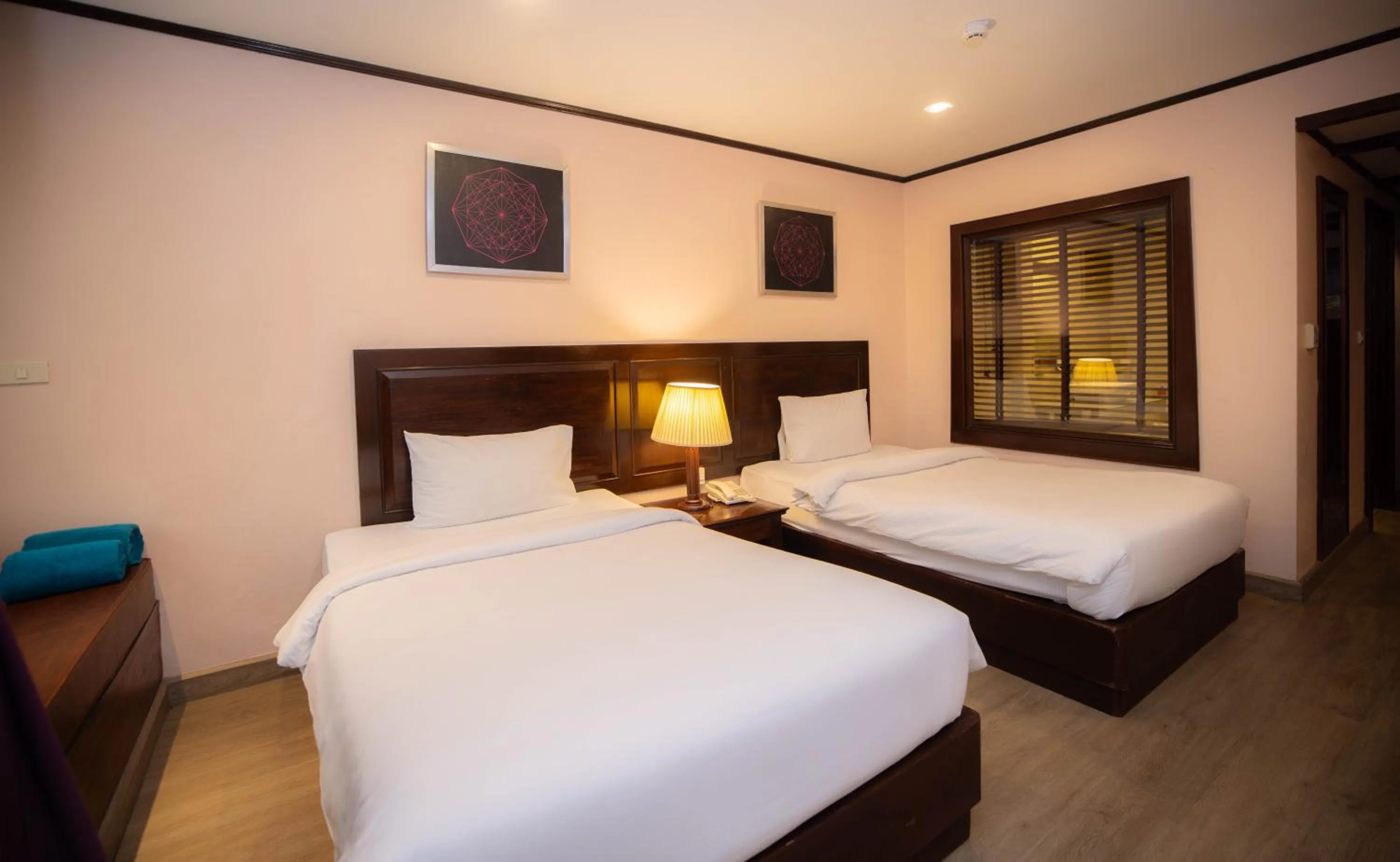 Bed in Baumanburi Hotel Patong