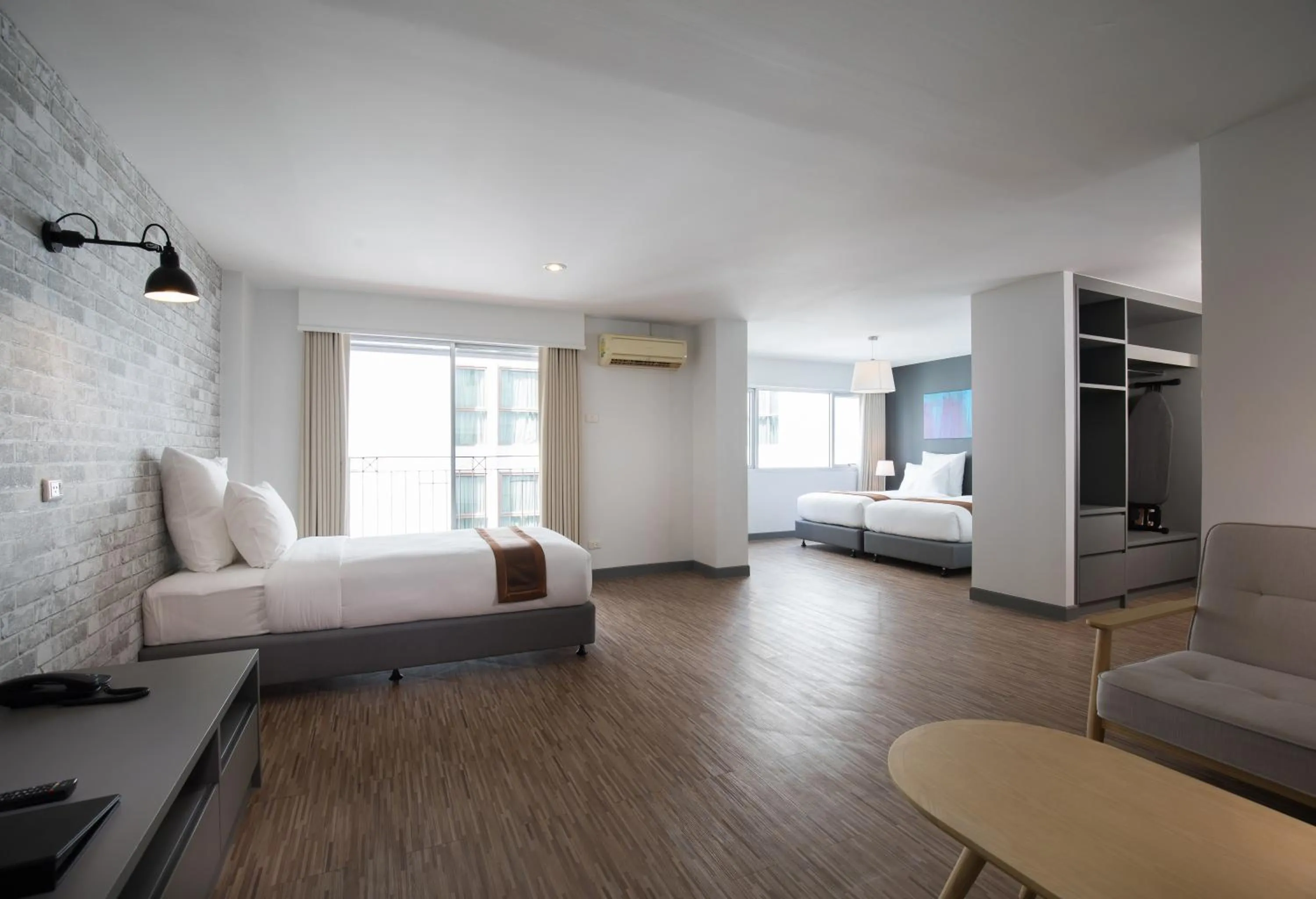 Living room, Bed in Journeyhub Pattaya Central