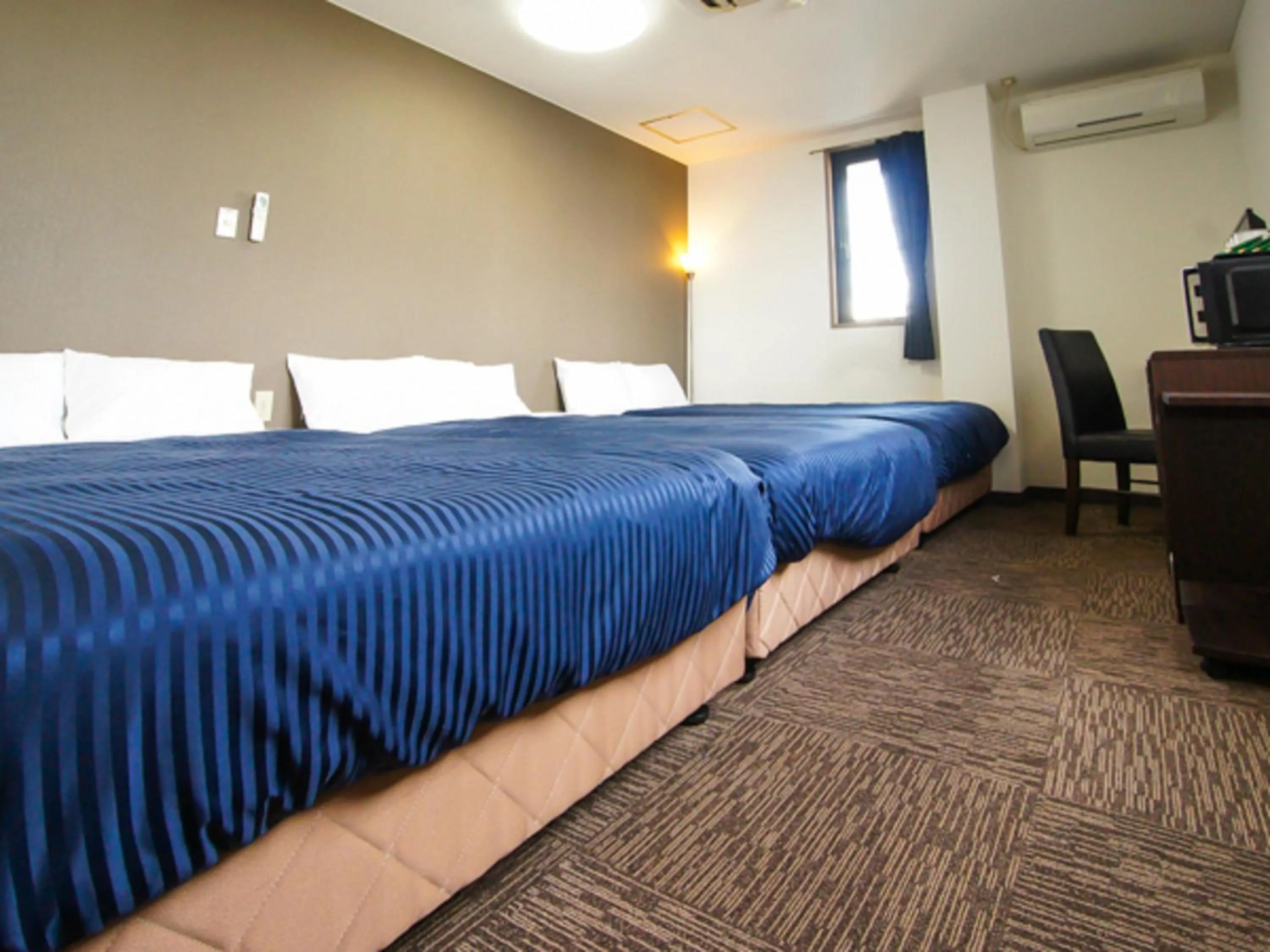 Bed in HOTEL LiVEMAX BUDGET Gunma Numata