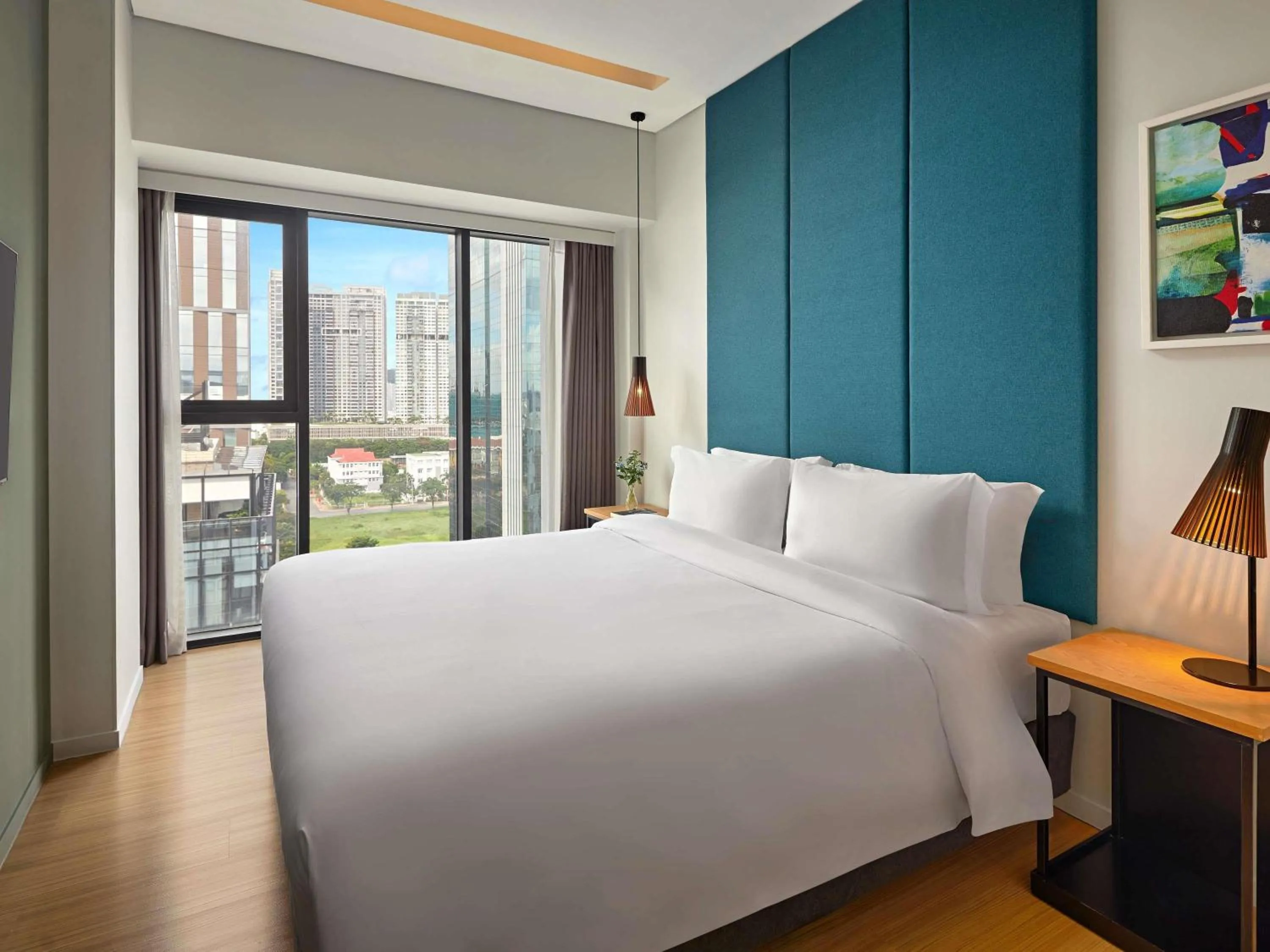 Bedroom, Bed in Novotel Living Saigon South