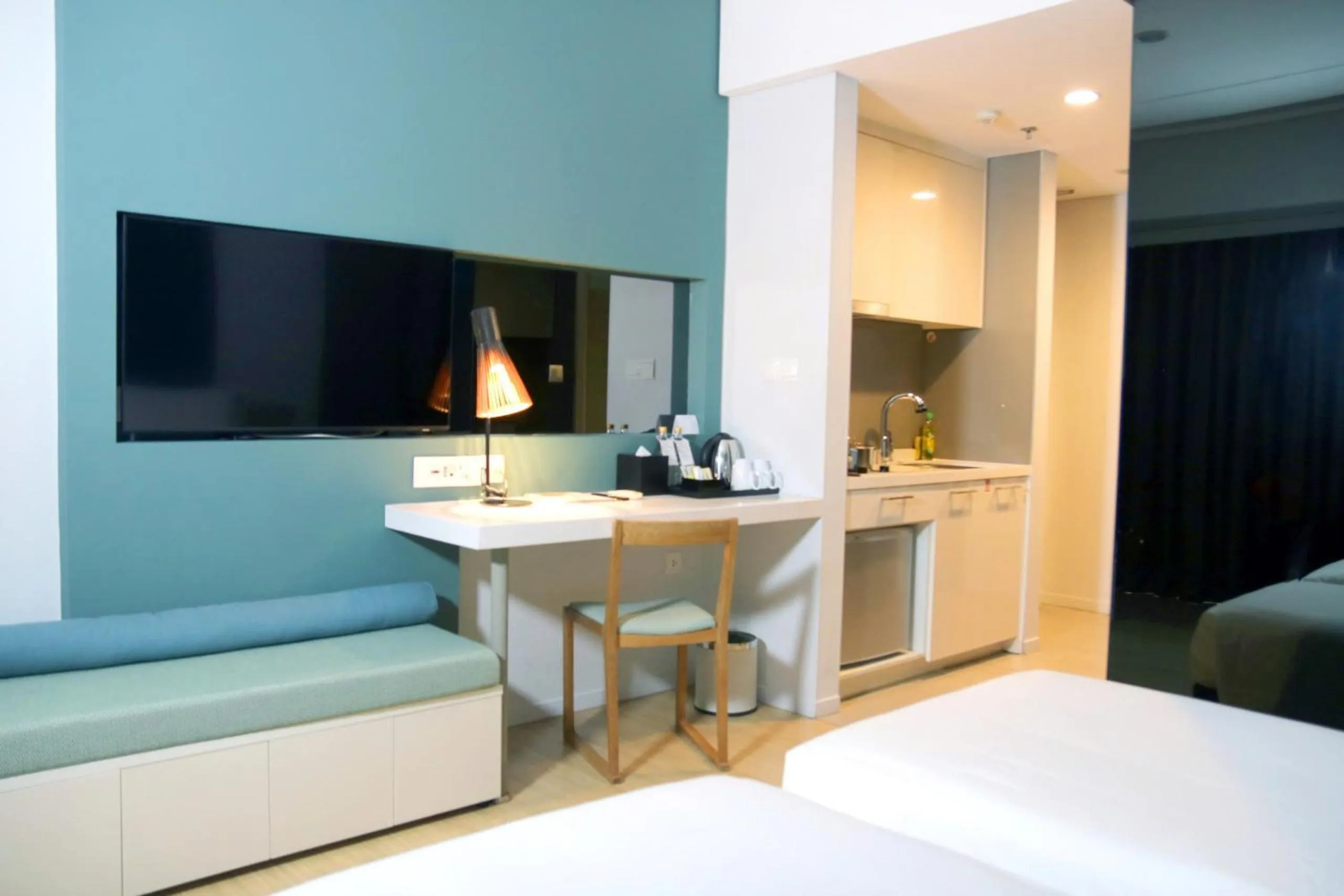 Kitchen or kitchenette, Bed in Novotel Living Saigon South