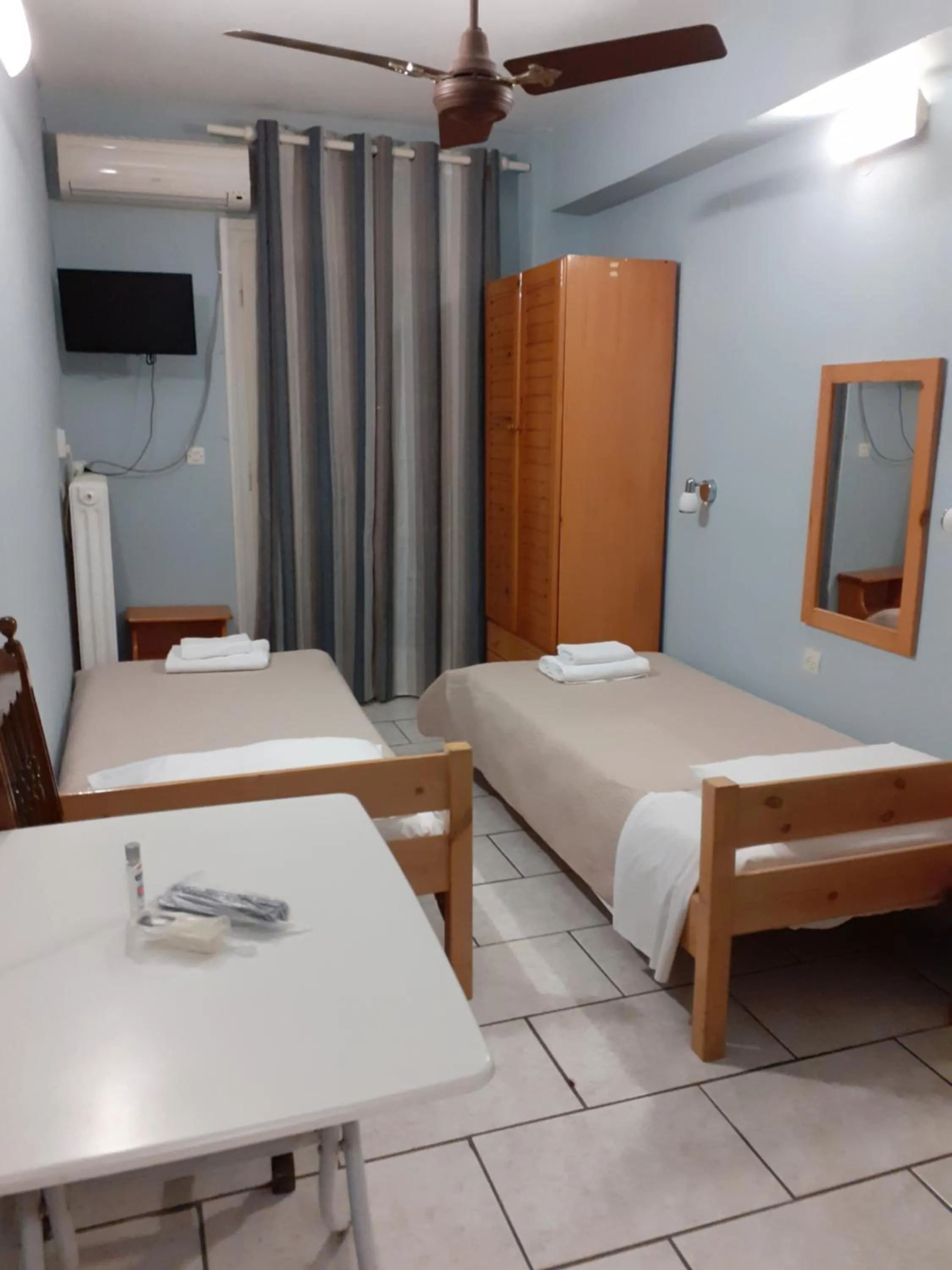 Bed in Almiriki Rooms