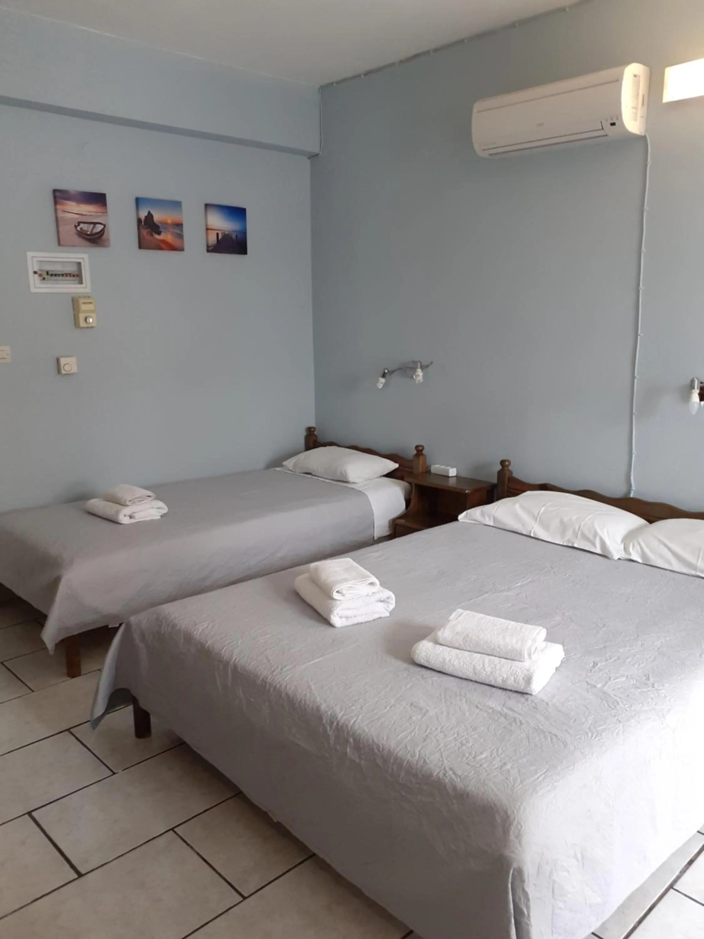 Bed in Almiriki Rooms