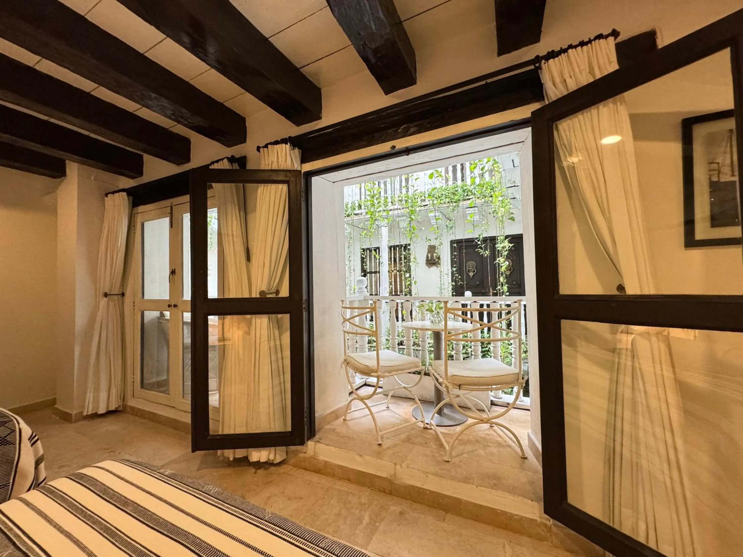 Balcony/Terrace, Bed in Leones de Alba Hotel Boutique