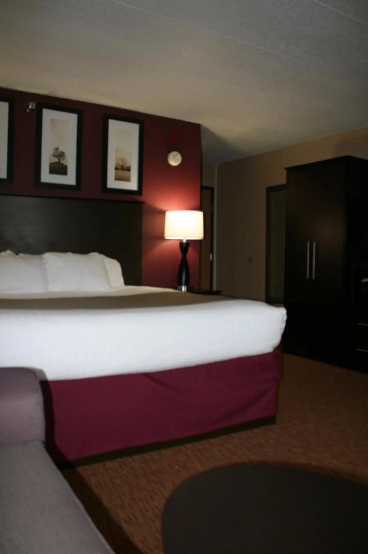 Bed in AmericInn by Wyndham Osceola