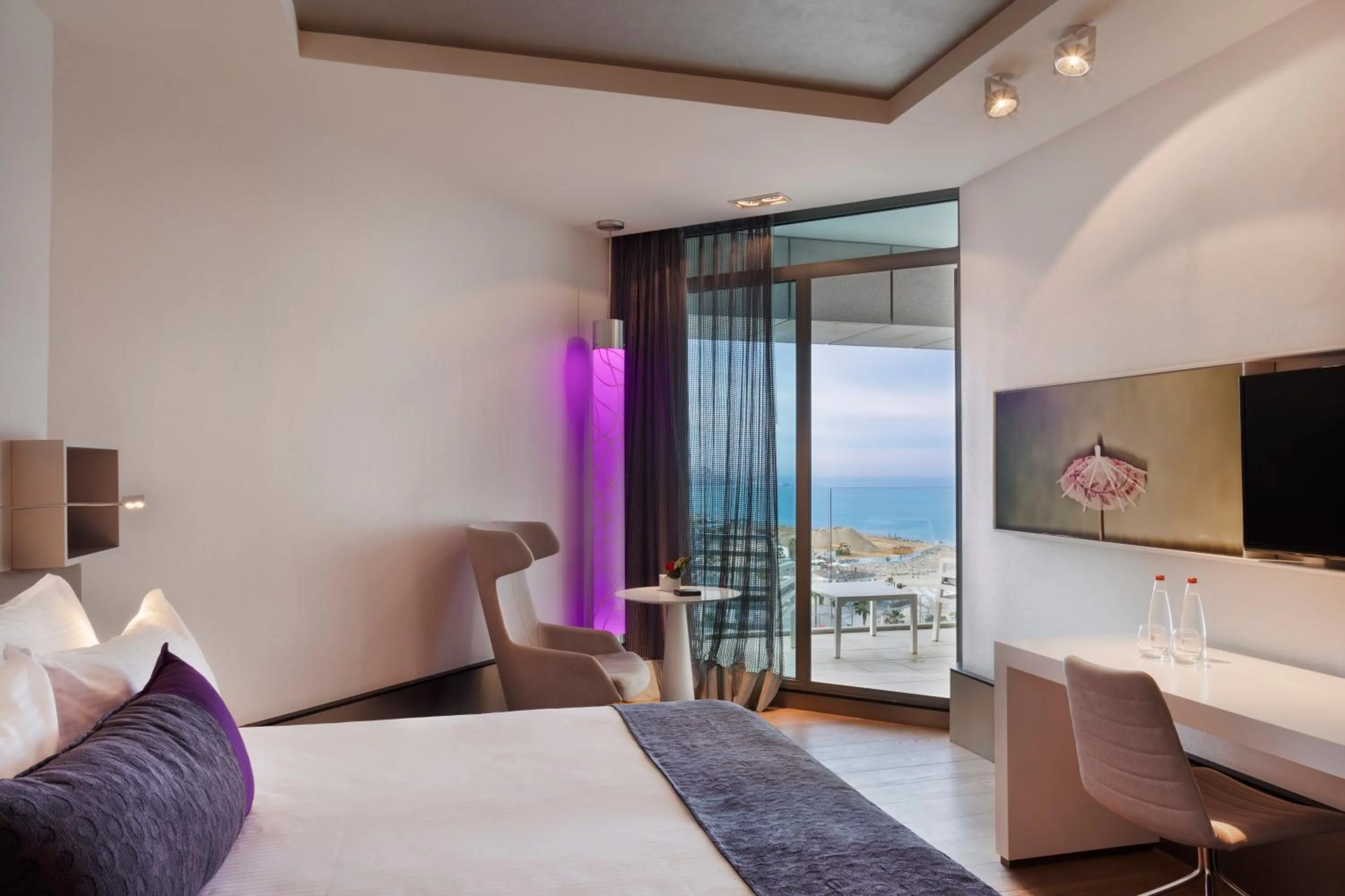 Seating area, Bed in Royal Beach Hotel Tel Aviv by Isrotel Exclusive