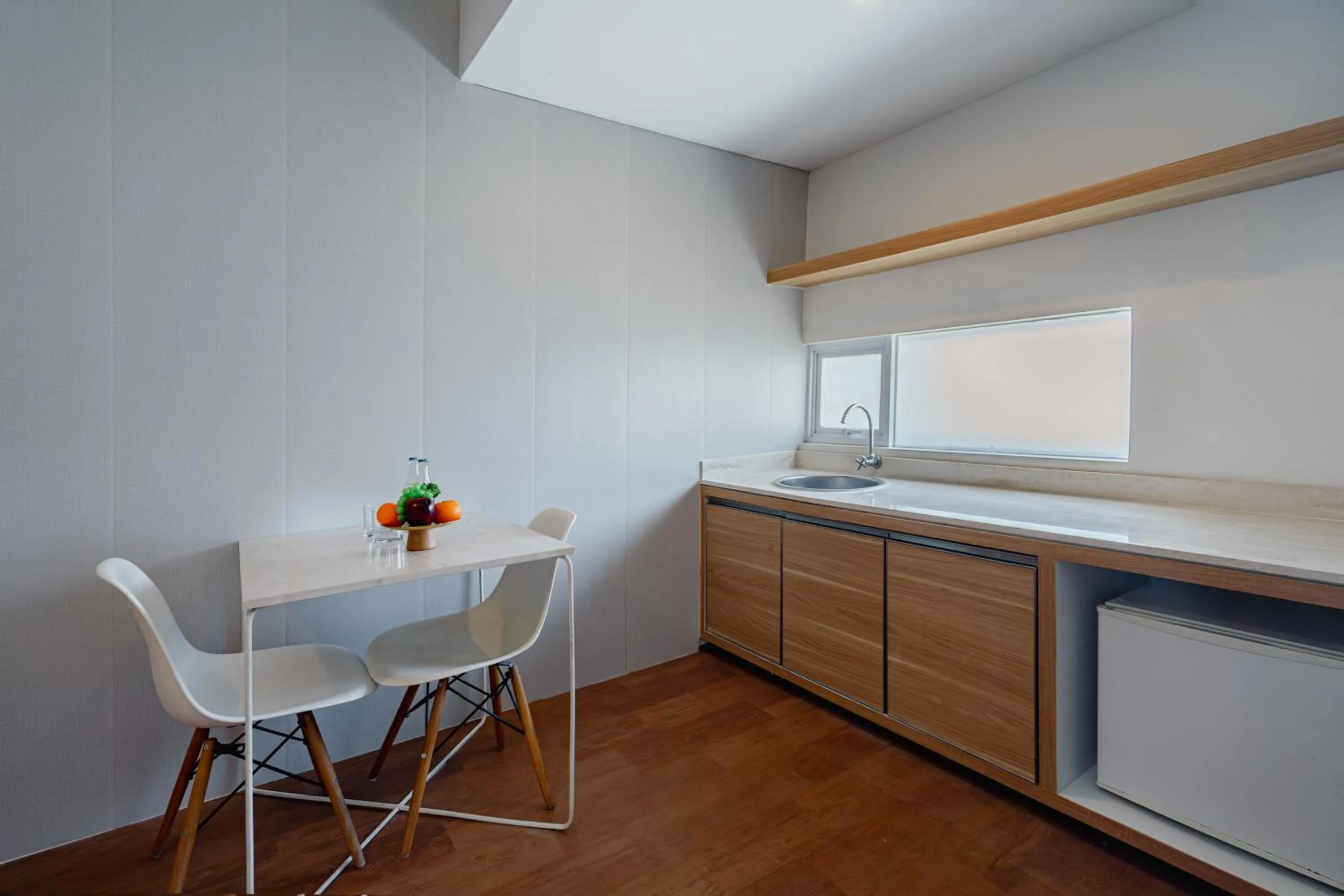 Kitchen or kitchenette in The Rooms Apartment Bali by ARM Hospitality